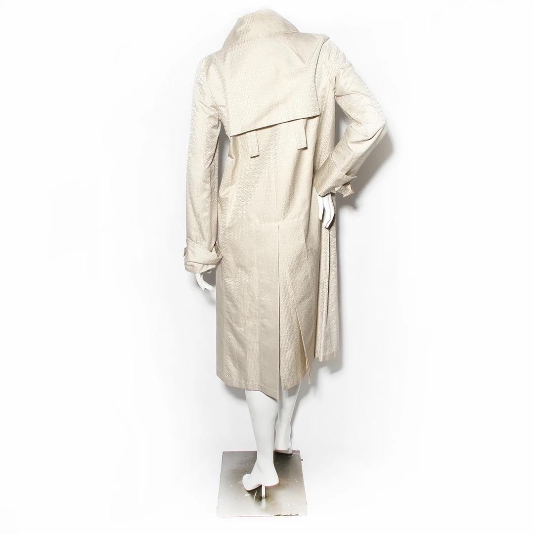Gucci by Frida Giannini Trench Coat 
Vintage 
Produced in 2005
Made in Italy
Double breasted with brown wood buttons 
Oversize collar 
Neck has fabric strap and button closure and two hook and eyes
Straps at the cuffs of the sleeves with gold tone