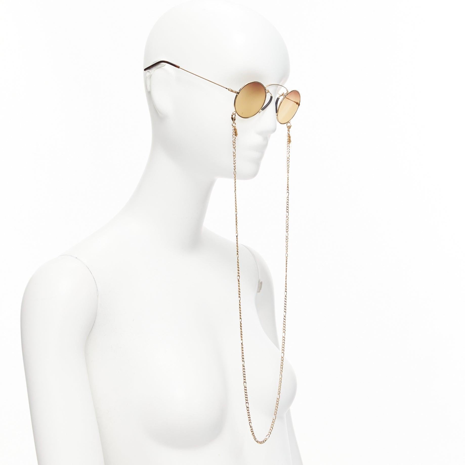 Gucci GG0991S lenti gialle e occhiali da sole geomritrici neri con catena
Riferimento: TGAS/D01054
Marchio: Gucci
Model No: GG0991S
Materiale: Metallo
Colore: Oro, Nero
Modello: Tinta unita
Fodera: Metallo dorato
Dettagli extra: Ciondolo con logo su