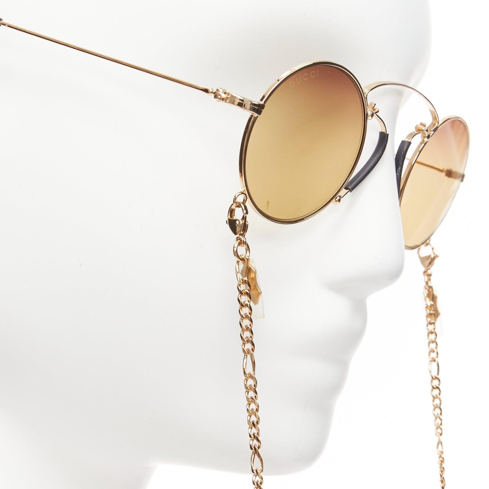 Donna Gucci GG0991S lenti gialle e occhiali da sole geomritrici neri con catena in vendita