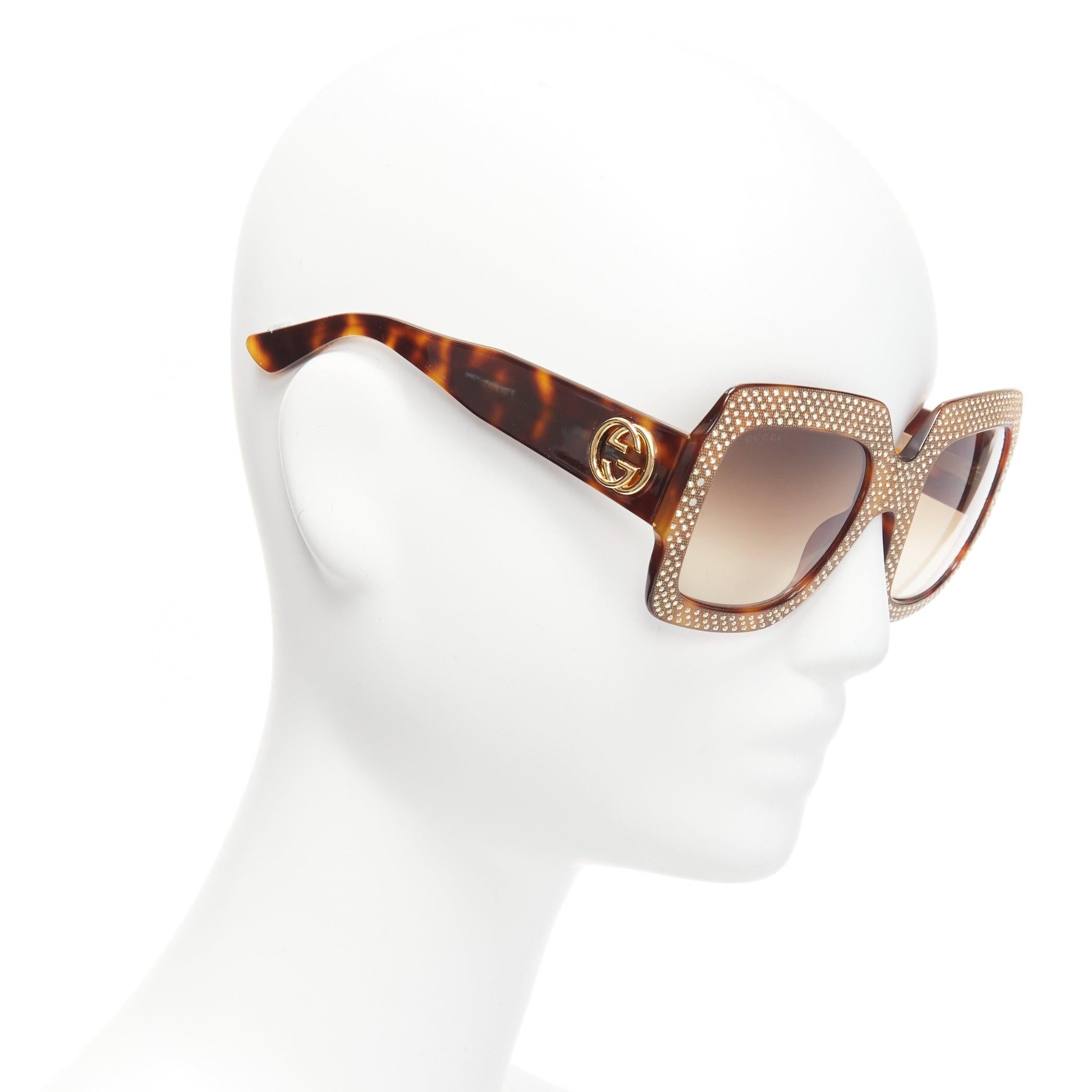 GUCCI GG3861 gold crystal oversized rectangular tortoise sunglasses
Reference: NKLL/A00073
Brand: Gucci
Model: GG3861
Material: Plastic
Color: Gold, Brown
Pattern: Crystals
Made in: Italy

CONDITION:
Condition: Excellent, this item was pre-owned and