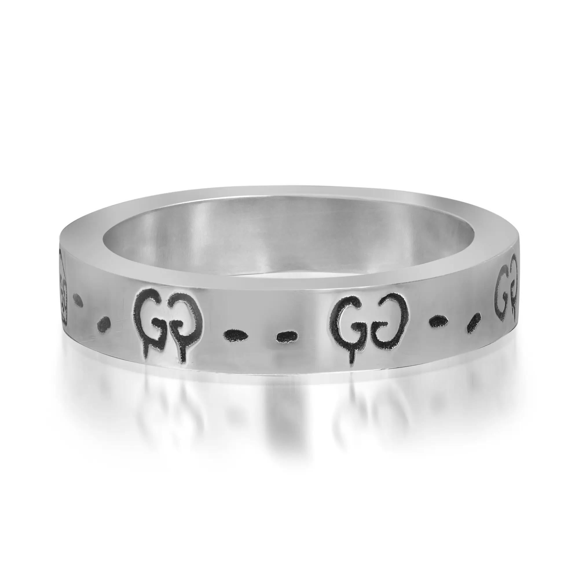 This ring features a repeating engraved Gucci Ghost motif all the way around the band, a design collaboration with Gucci and artist Trouble Andrew. Designed in 925 sterling silver. Ring size: 14 US 7. Ring width: 4mm. Total weight: 4.89 grams. Made