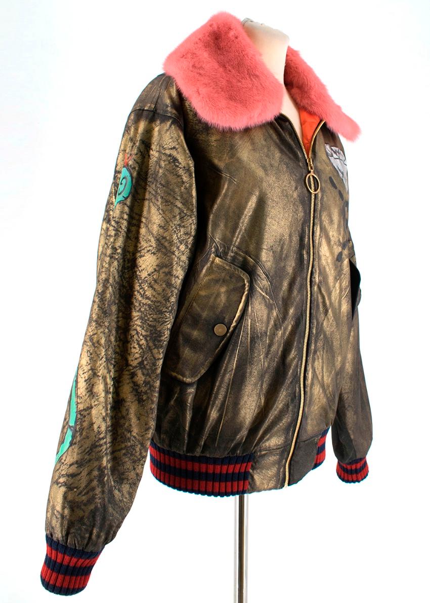 Gucci Ghost Hand Painted Bomber with Pink Mink Fur Collar

- removable pink mink fur collar - orange quilted silk lining - contrasting elasticated wool hem - graphics on the arm and back - gold zip fastening - multiple pockets 

Please note, these