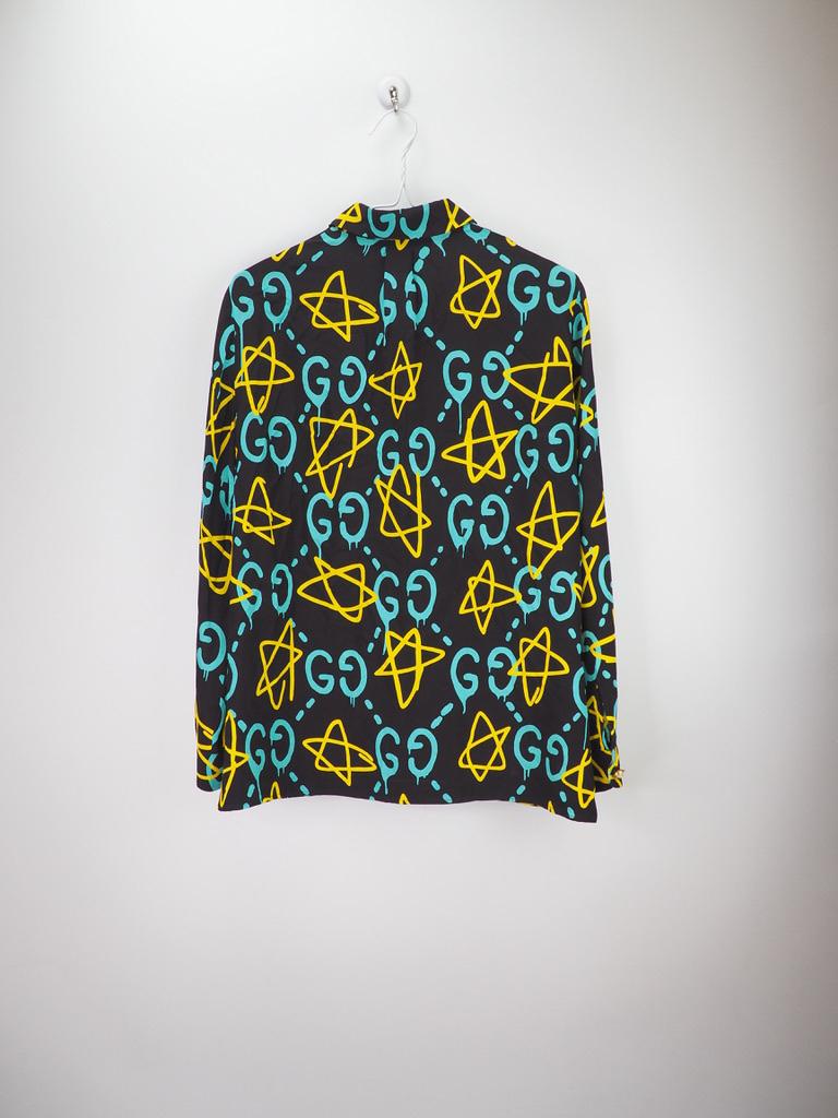Gucci Black Nylon Ghost Printed Shirt, features GG Logo, Yellow Stars Blouse 6 US Casual Top Authentic Gucci Ghost style with a button up interior, pearl and gold buttons. 

COLOR: Black, light blue, and yellow. 
MATERIAL: 100% silk, 100% nylon