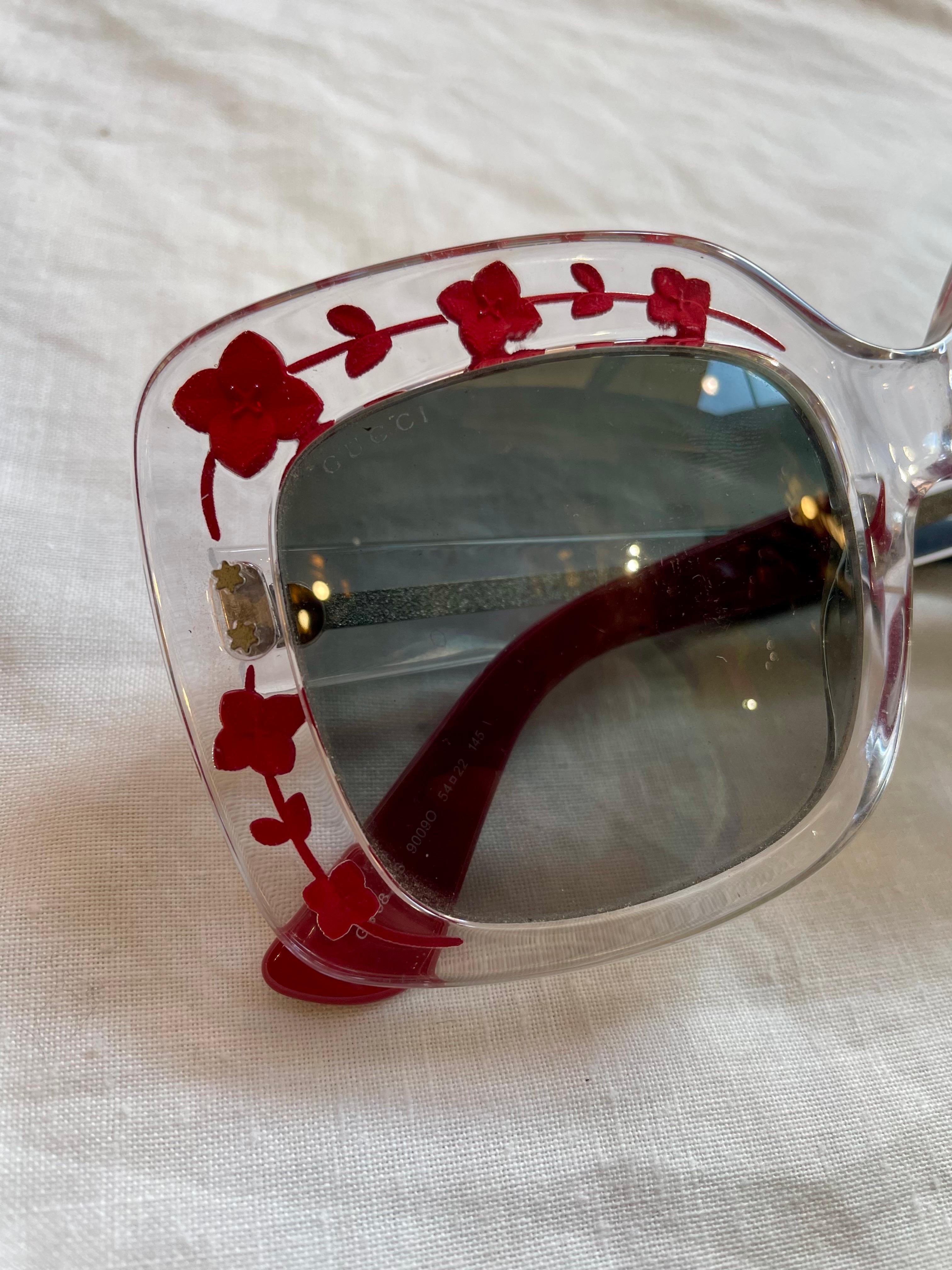 Black Gucci glasses in transparent plastic with red flowers For Sale