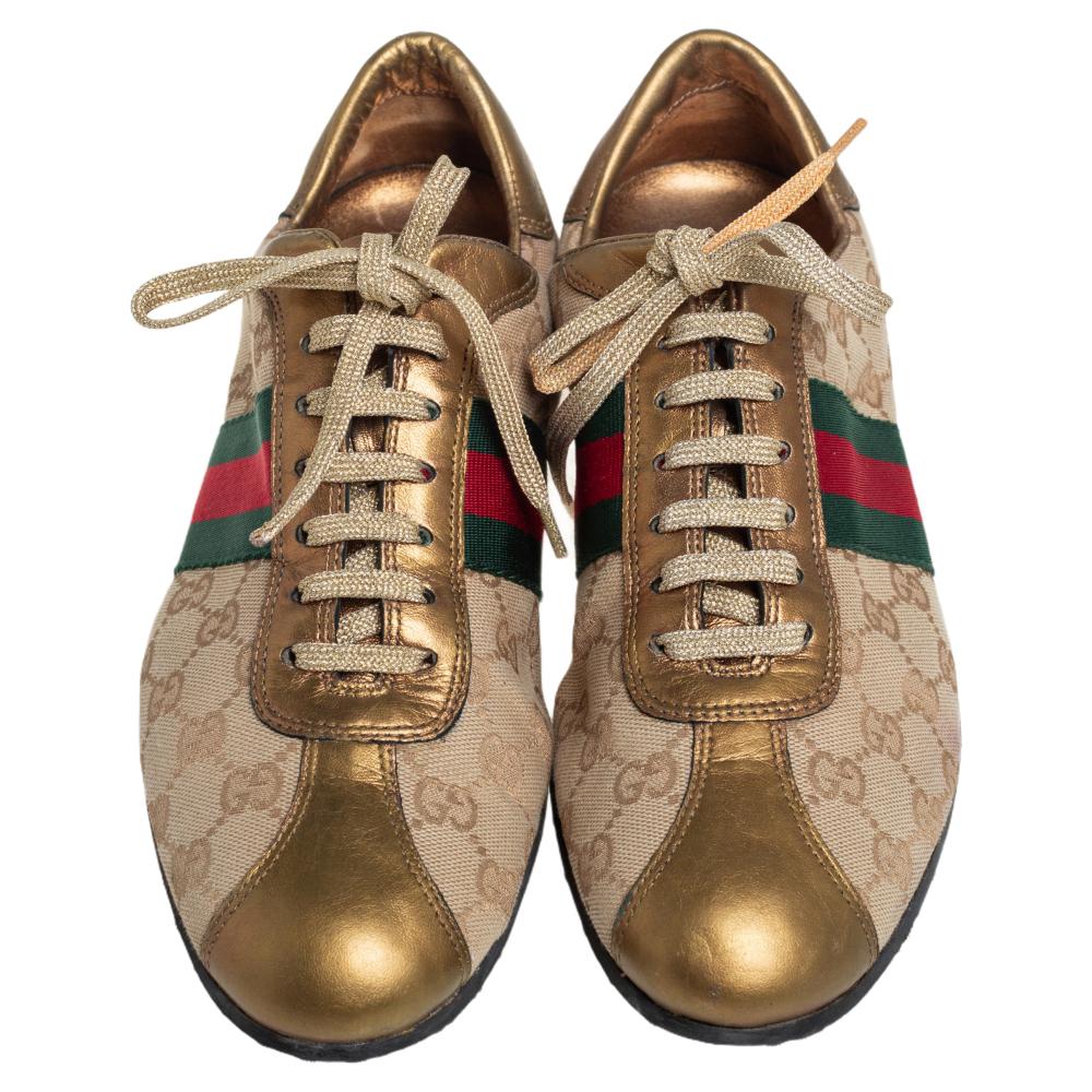 Step into these Gucci sneakers for instant comfort! They feature the iconic Gucci Web detail and leather trims on the signature GG canvas exterior. They are lined with leather and finished with lace-ups. Pair these with practical casuals for a