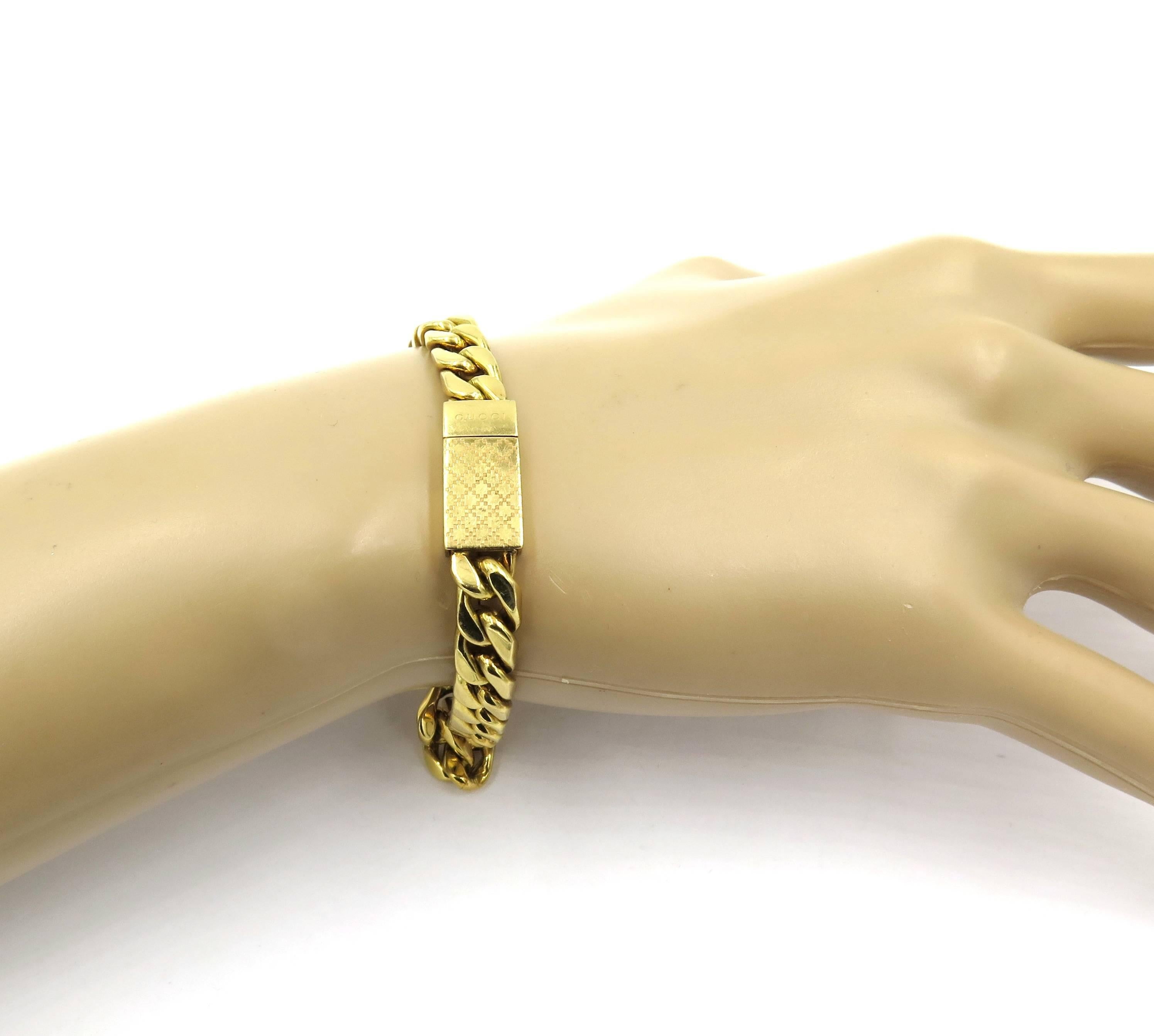 An 18 karat yellow gold bracelet, Gucci. From the Diamantissima collection. Designed as a polished flat curb link chain, with rectangular clasp, enhanced by engraved navette shaped patterns. Length is approximately 8 inches. Gross weight is