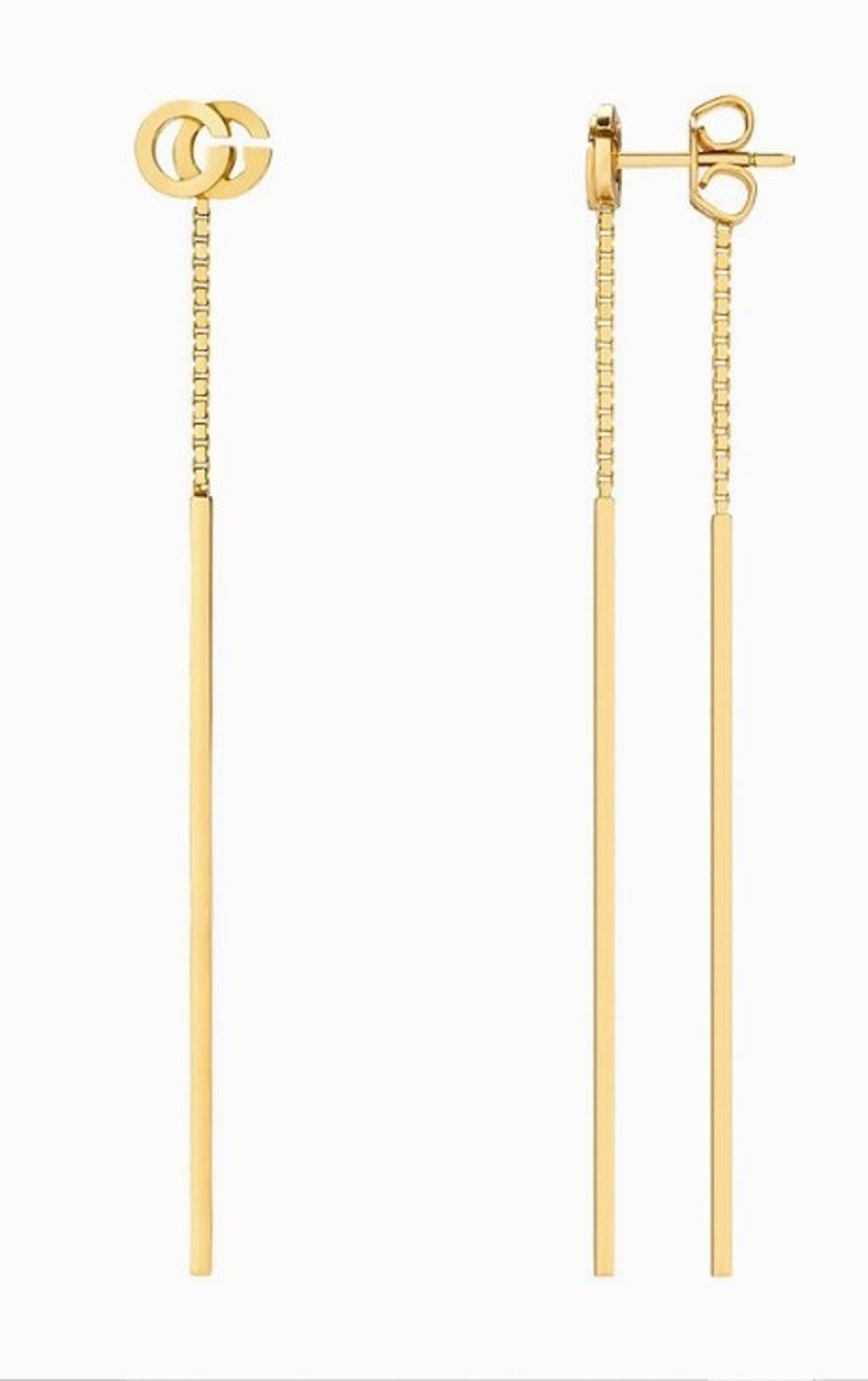 Boucles d'oreilles longues avec pendentif GG Running en or de Gucci Unisexe en vente