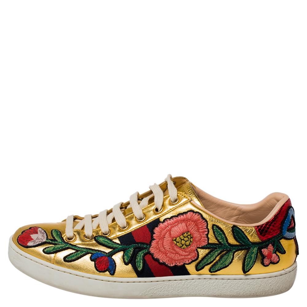 Stacked with signature details, this Gucci pair is rendered in leather and is designed in a low-cut style with lace-up vamps. They have been fashioned with the iconic web stripes and floral embroidery. Complete with red and blue trims carrying the