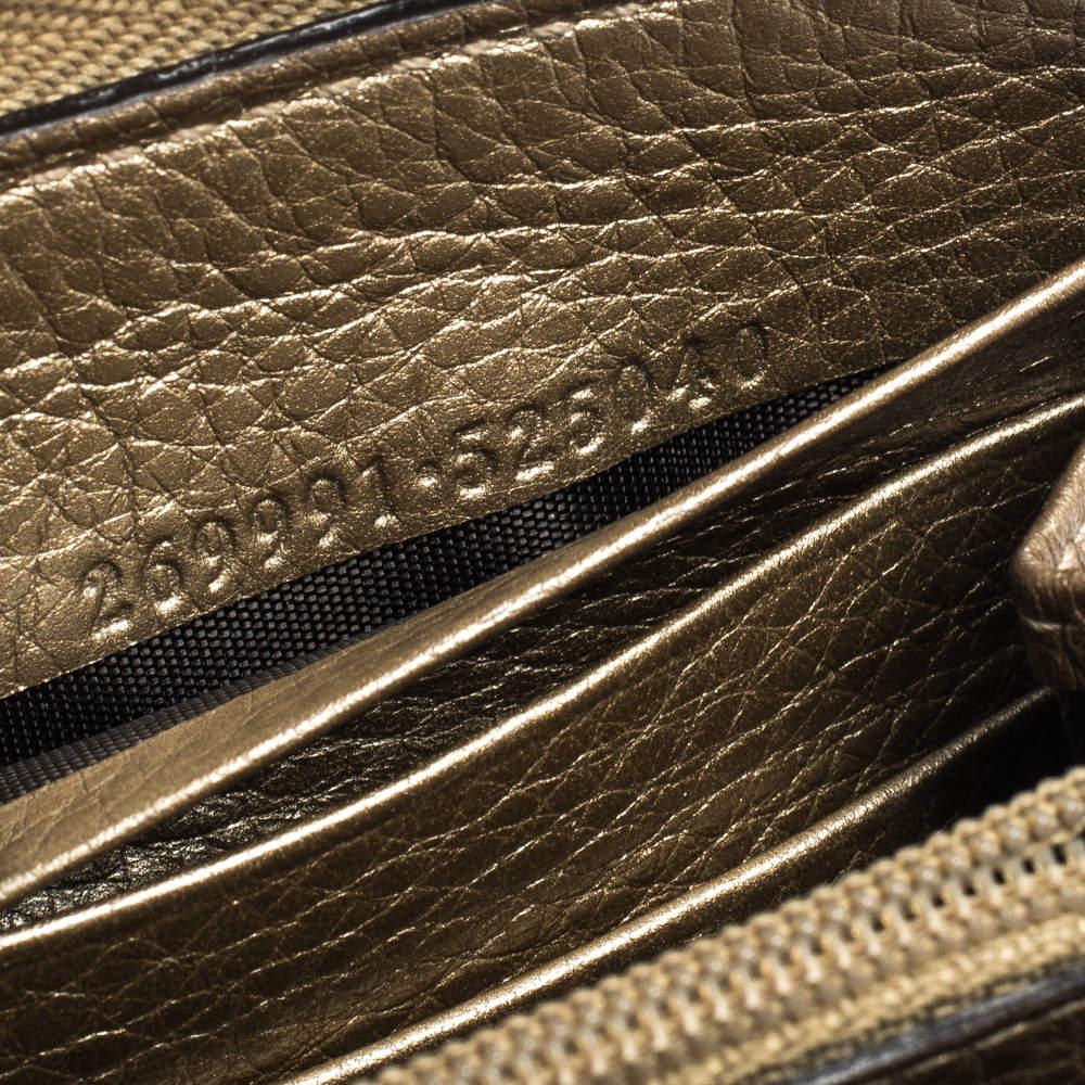 Marrone Gucci Portafoglio in pelle oro con fiocco di nappe e zip intorno al portafoglio in vendita