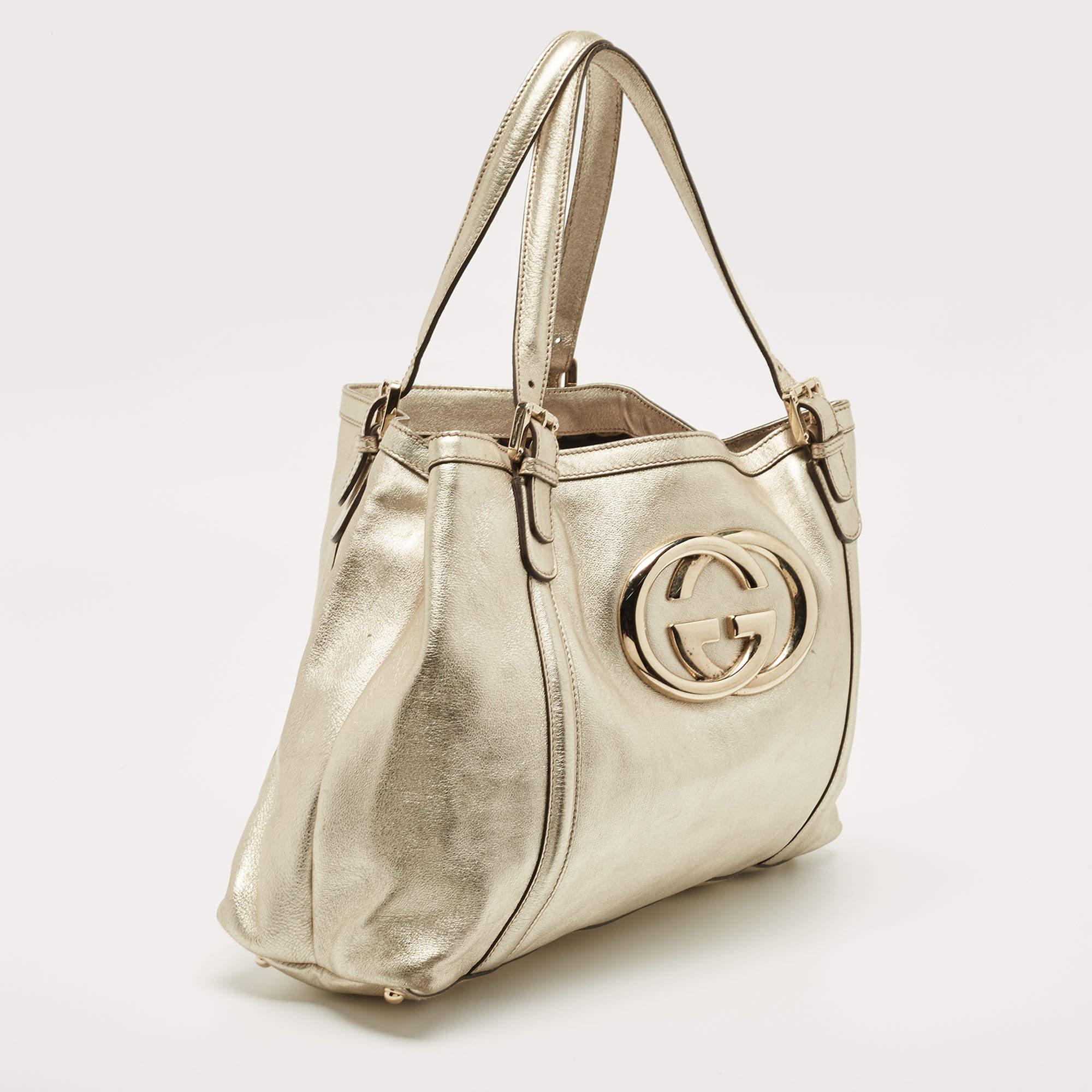 This designer tote from the House of Gucci is super classy and functional, perfect for everyday use. It is made from gold leather on the exterior with a GG logo adorning the front.

