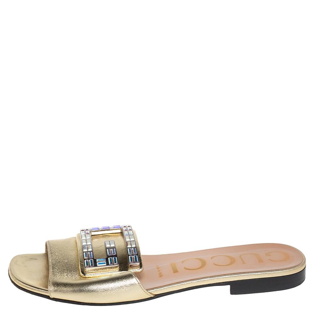 When it comes to investing in a pair of statement slides, Gucci comes to mind. These slides are a perfect example of the brand's exemplary design sense and quality. Crafted from luxurious leather, they come in gold and styled with open toes. The