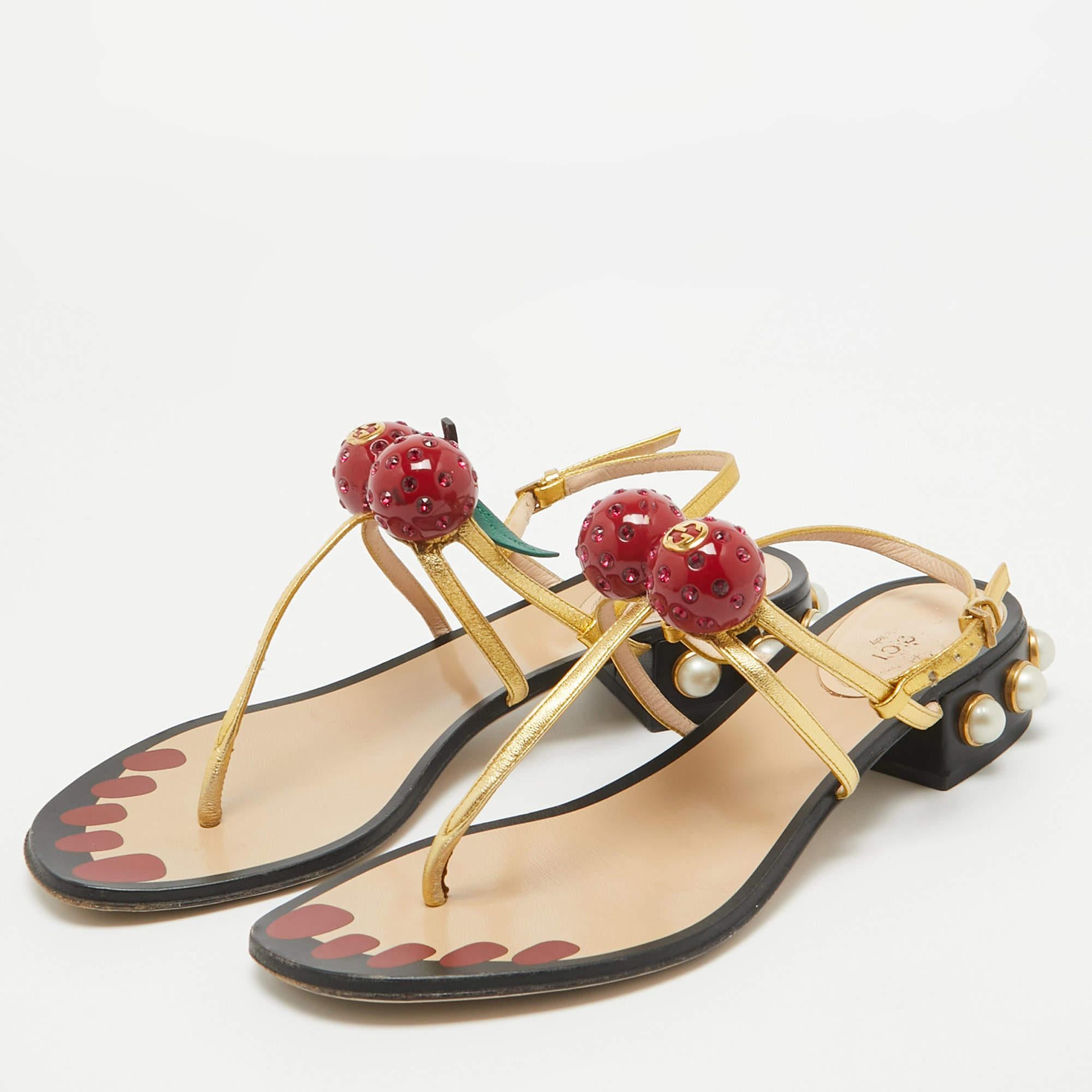 No wardrobe is complete without a gorgeous pair of flats to complete your casual looks. This pair from the house of Gucci makes for a very chic addition. Crafted from leather the sandals have buckle fastening cherry details and embellished heels for