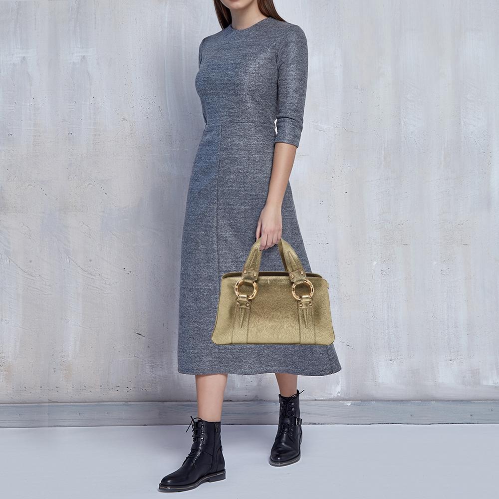 Functional and stylish, this designer label's collections capture the effortless, elegant finesse of the modern woman. Crafted from quality materials, this chic bag is easy to carry and can fit in your daily essentials effortlessly.

Includes: