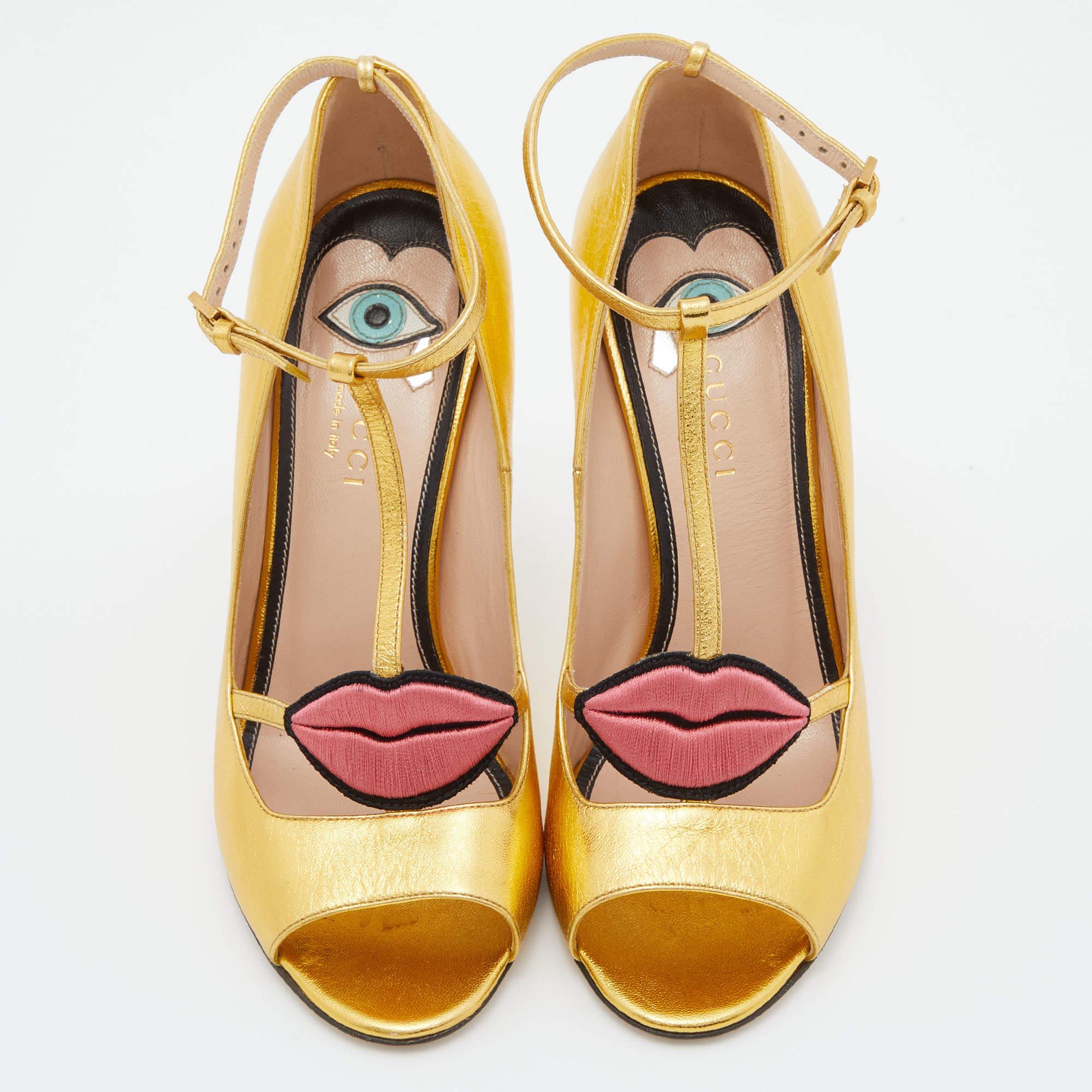 How can one not fall in love with these sandals by Gucci! They've been beautifully crafted from striking gold-hued leather and styled with playful embroidered lips on the uppers. The sandals carry peep toes, t-strap forming the ankle fastenings, and