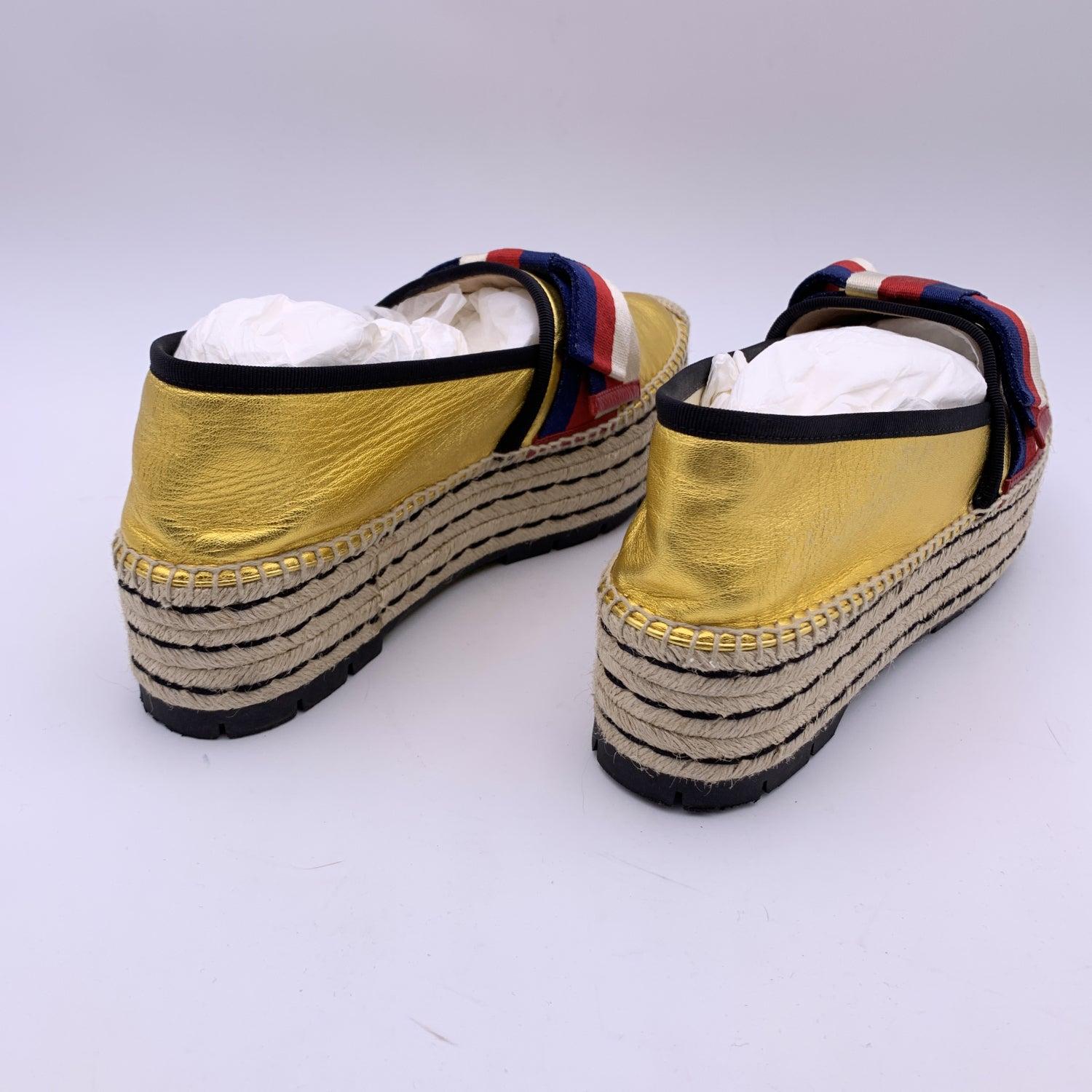 Gucci Gold Leather Sylvie Web Bow Espadrilles Platform Flats Size 41 In Excellent Condition In Rome, Rome
