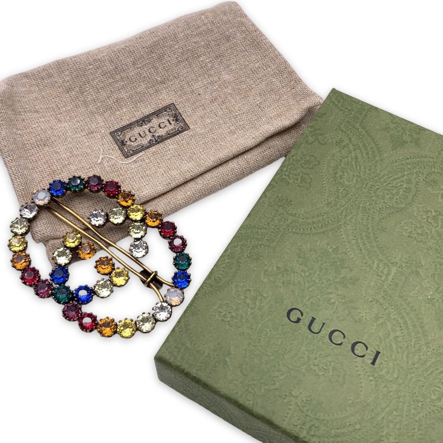 Lovely Gucci Interlocking G Logo hair clip. Gold metal hair clip with multicolored crystals. Width: 2.75 inches - 7 cm. Height: 2 inches - 5.1. cm. Retail price is 450 Euros Details MATERIAL: Metal COLOR: Multicolour MODEL: - GENDER: Women COUNTRY