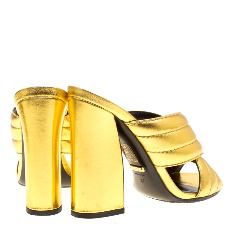 Gucci Gold Metallic Leather Sylvia Crossover Mules Size 37 In Good Condition In Dubai, Al Qouz 2