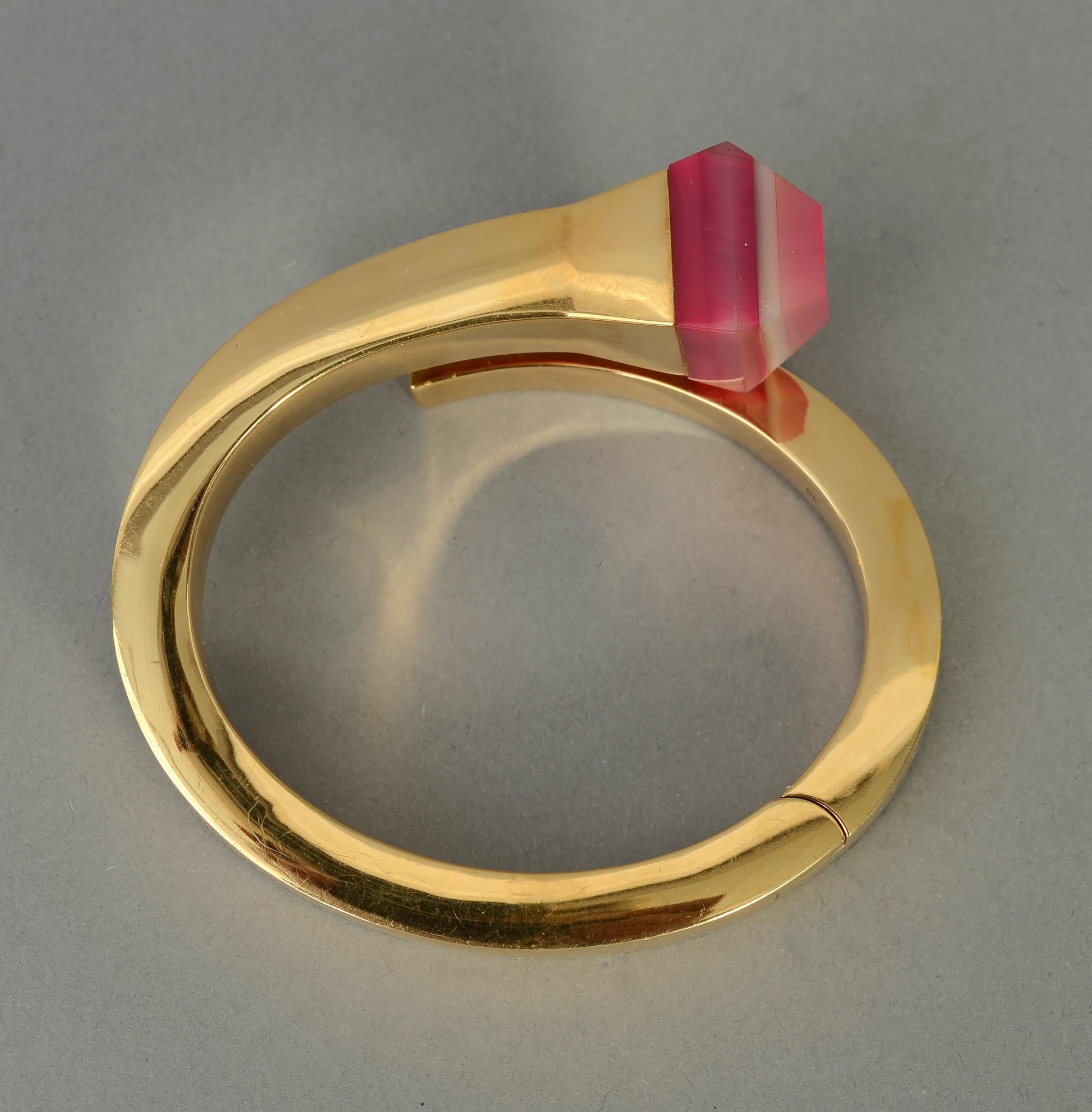 Stunning and most unusual gold nail bracelet by Gucci with a pink agate tip. The stone is pyramid shaped and measures 3/4