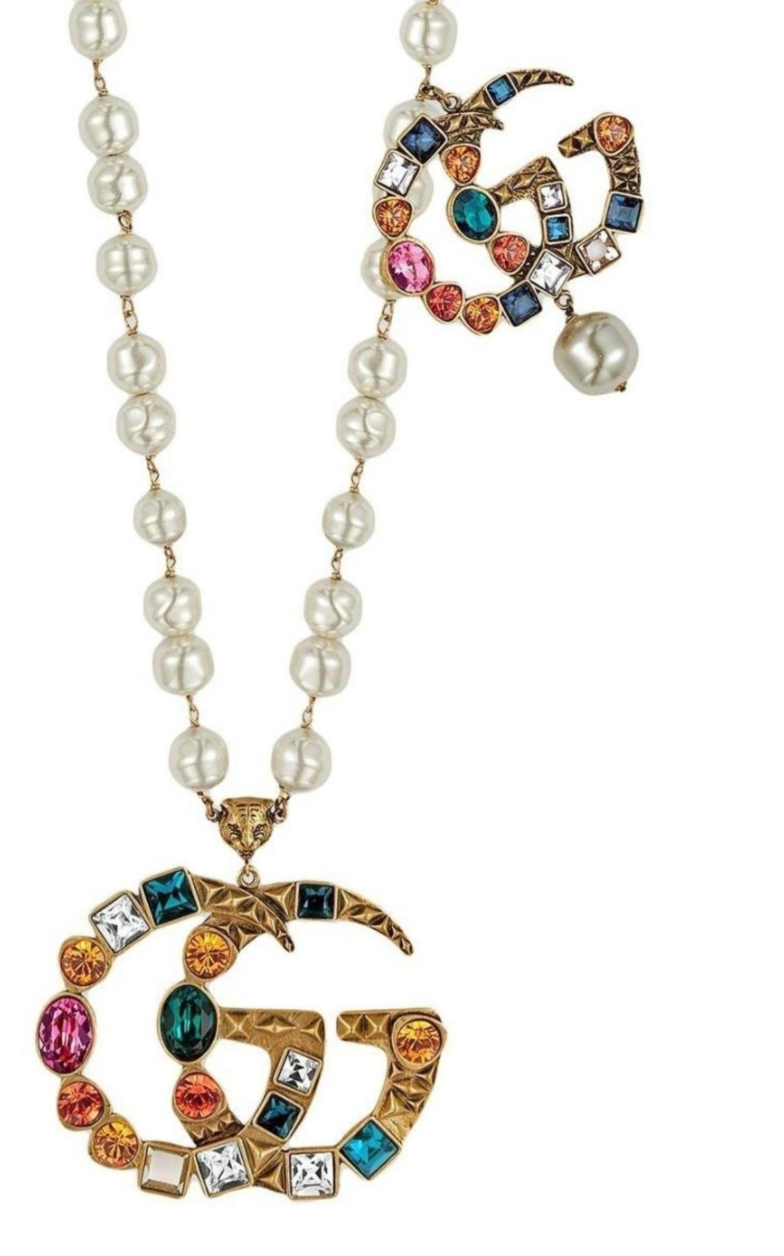 Perle Gucci Collier en métal plaqué or à double G en vente