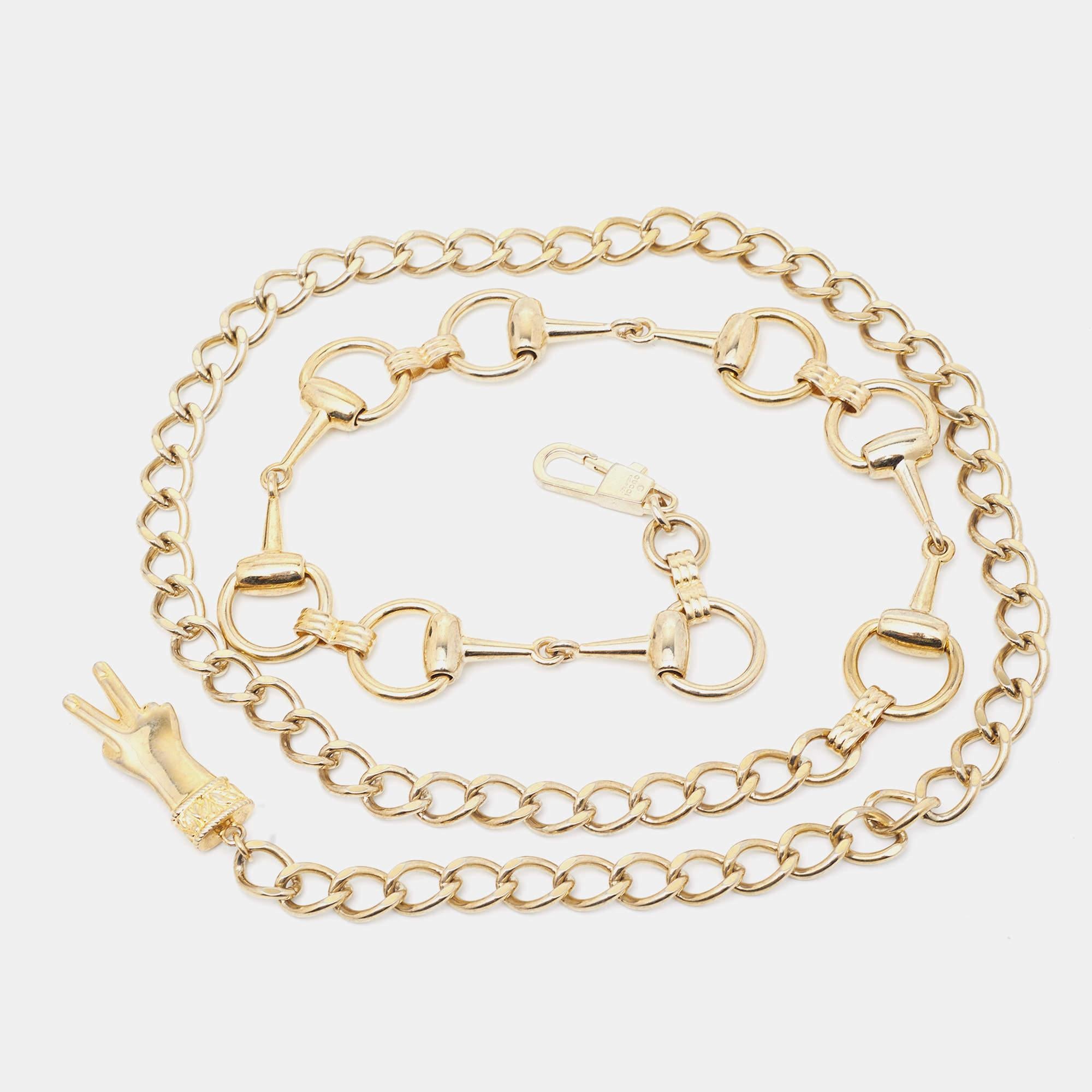 It features a gold-tone chain adorned with the iconic horsebit motif, creating a timeless and elegant look. This belt is a perfect statement piece to elevate any outfit with a touch of Gucci's signature style.

Includes: Original Dustbag
