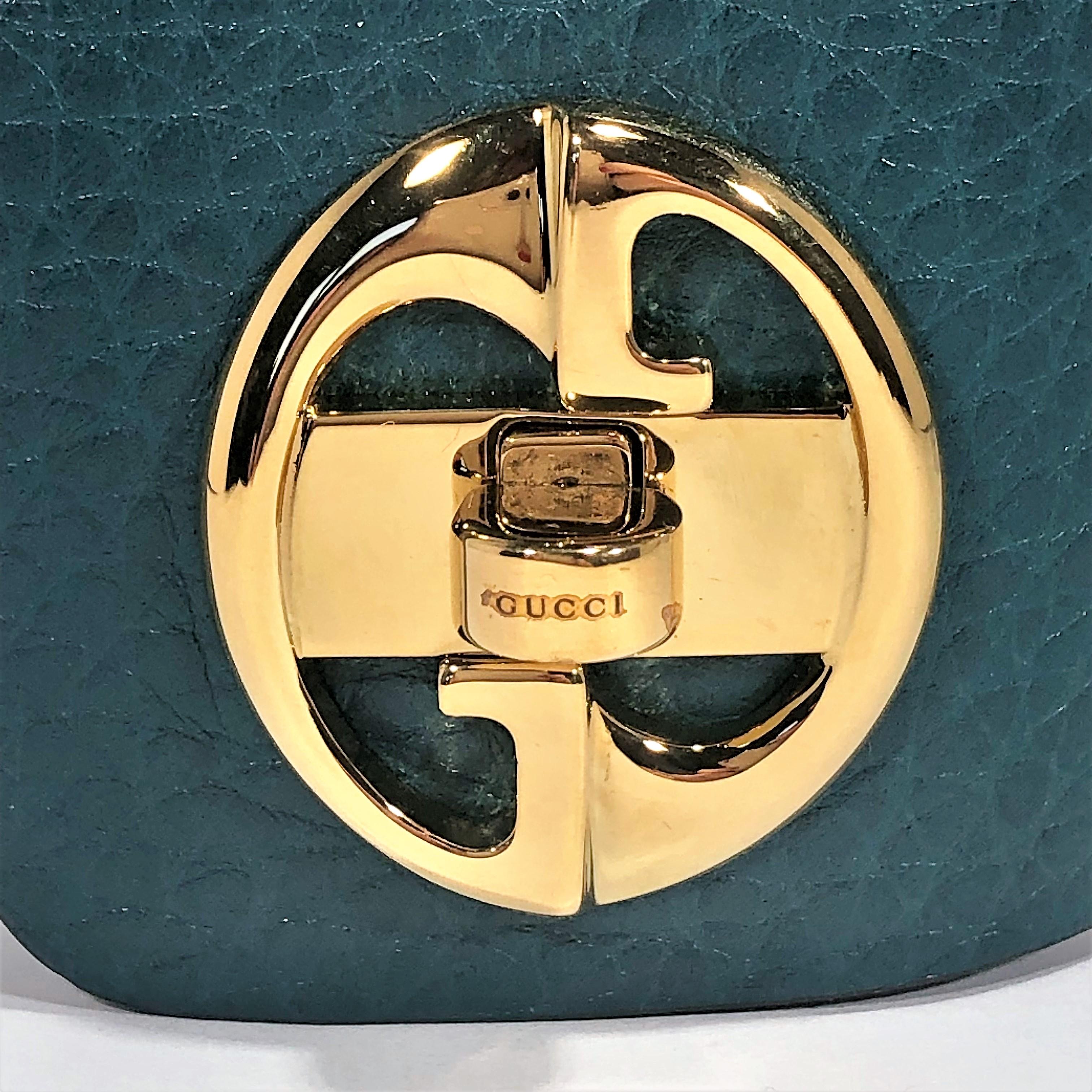 Women's Gucci Gold Tone Turnkey GG  Teal Color Embossed Leather Bracelet  For Sale