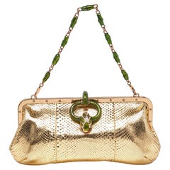 Bolso de piel de serpiente con hebilla de serpiente dorada de Gucci