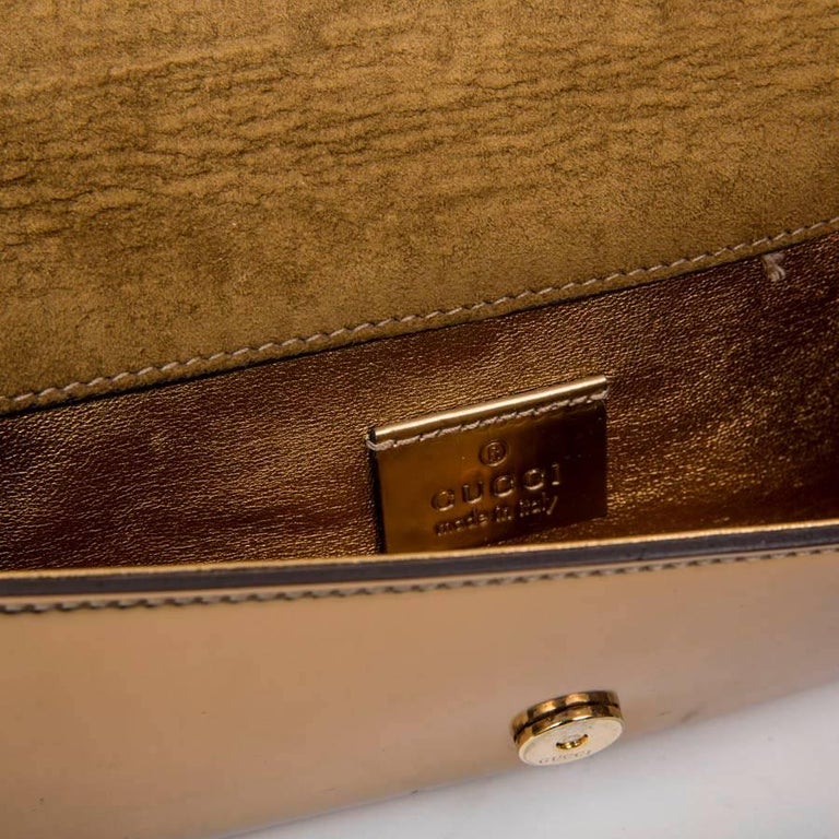 GUCCI Golden Leather Clutch For Sale at 1stdibs