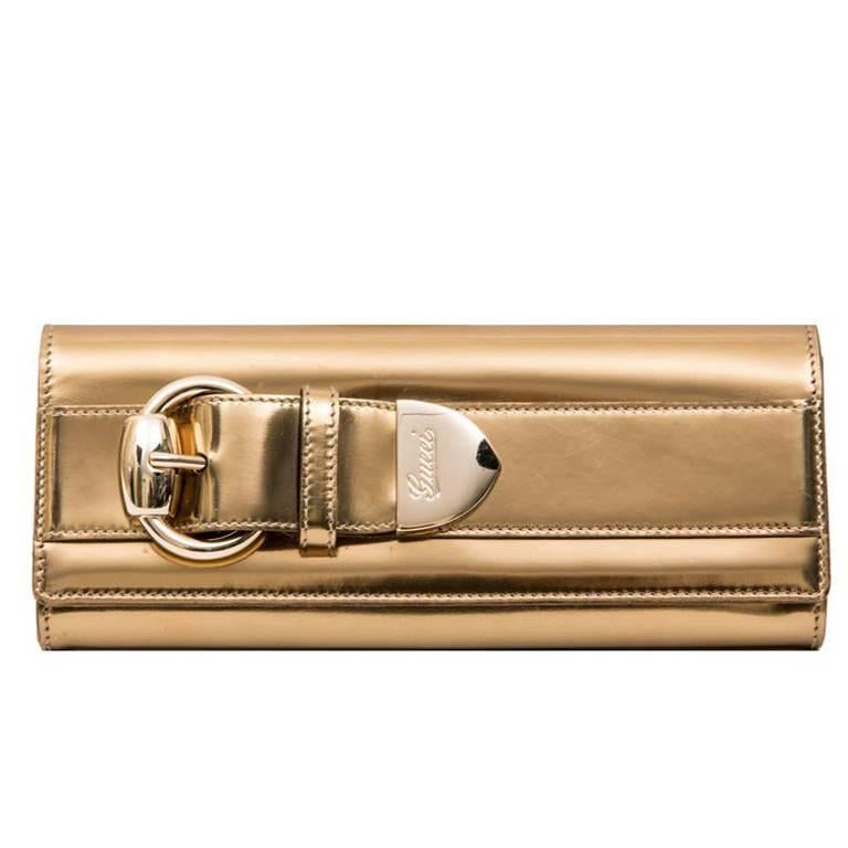 GUCCI Golden Leather Clutch For Sale at 1stdibs
