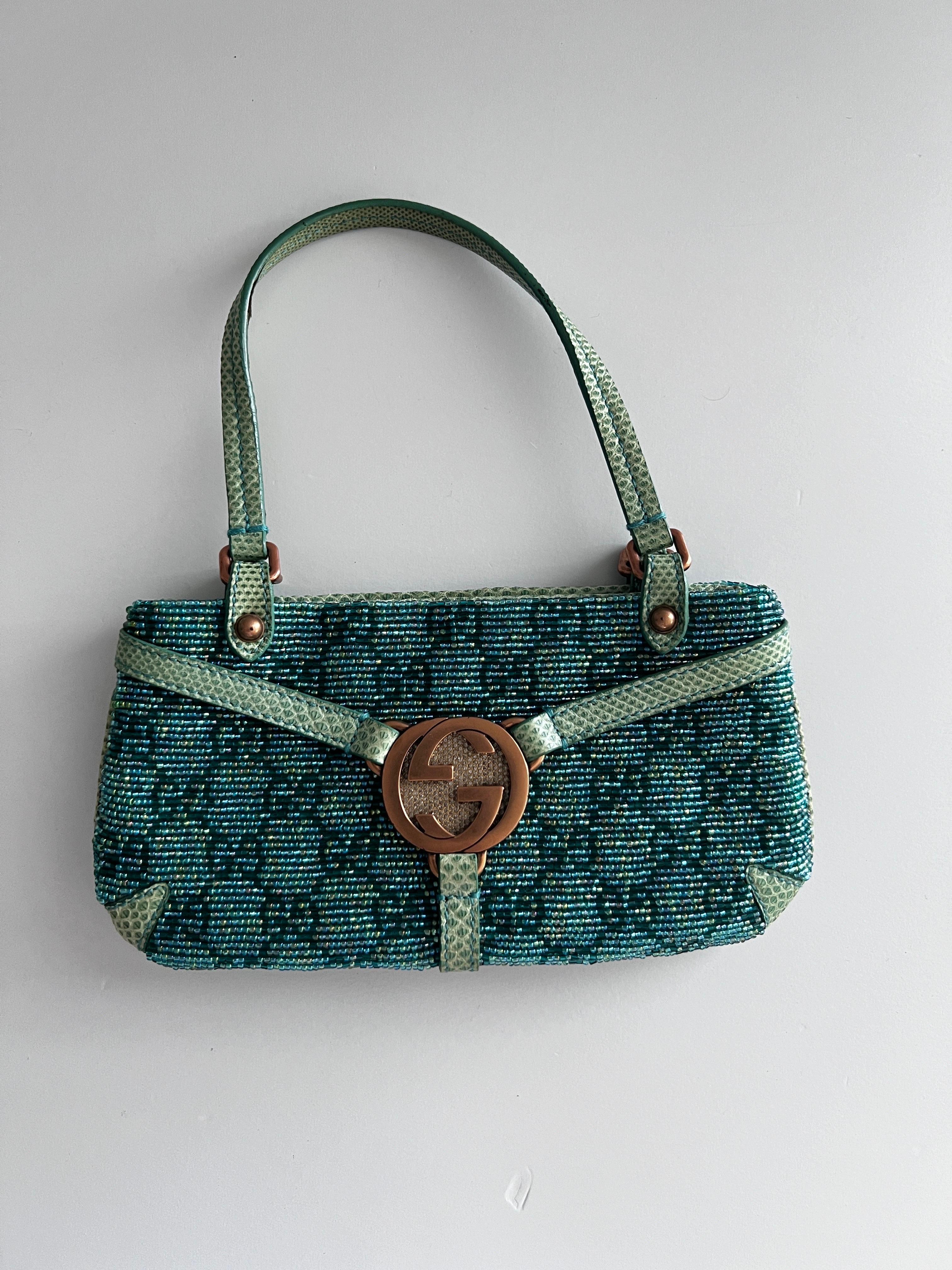 Gucci green beaded top handle bag with card holder
A Gucci signature piece in the famous GG Monogram
Beautiful green beaded  bag with lizard trimmings
Rose gold hardware with the Gucci signature GG and tiny crystals
Top handle bag
Card holder