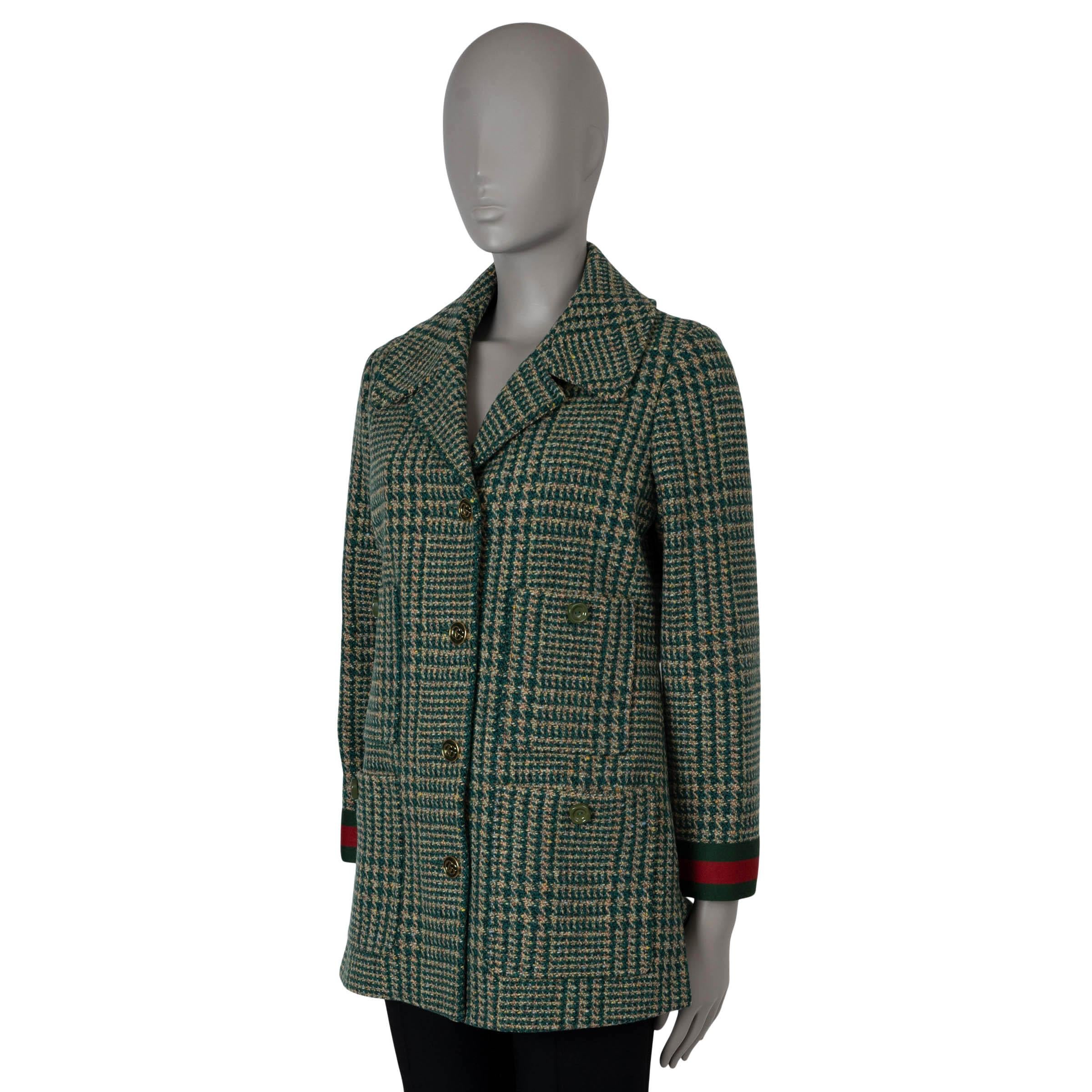 This 100% authentic Gucci tweed peacoat is crafted from a luxurious blend of dark green, beige, brown, pink, and baby blue houndstooth plaid wool (87%) and polyamide (13%). It features wide notched lapels, four buttoned pockets, a back belt, and