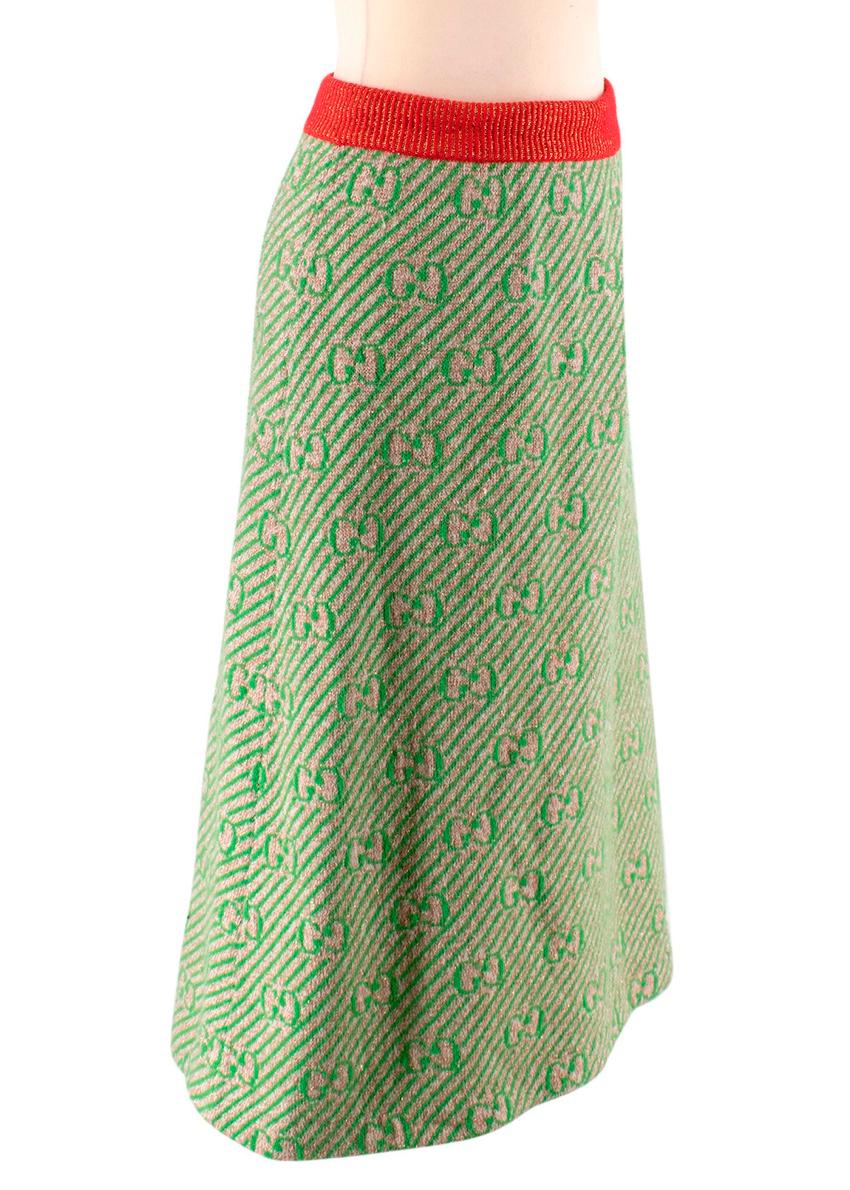 Gucci Green GG Logo Pattern Wool Knit Skirt

-Made of soft wool knit 
-Gorgeous GG logo print 
-Beautiful green and beige hues 
-Red ribbed elasticated waist 
-Classic flared cut
-Timeless elegant design 

MAterials:
96% wool, 2% polyamide,2