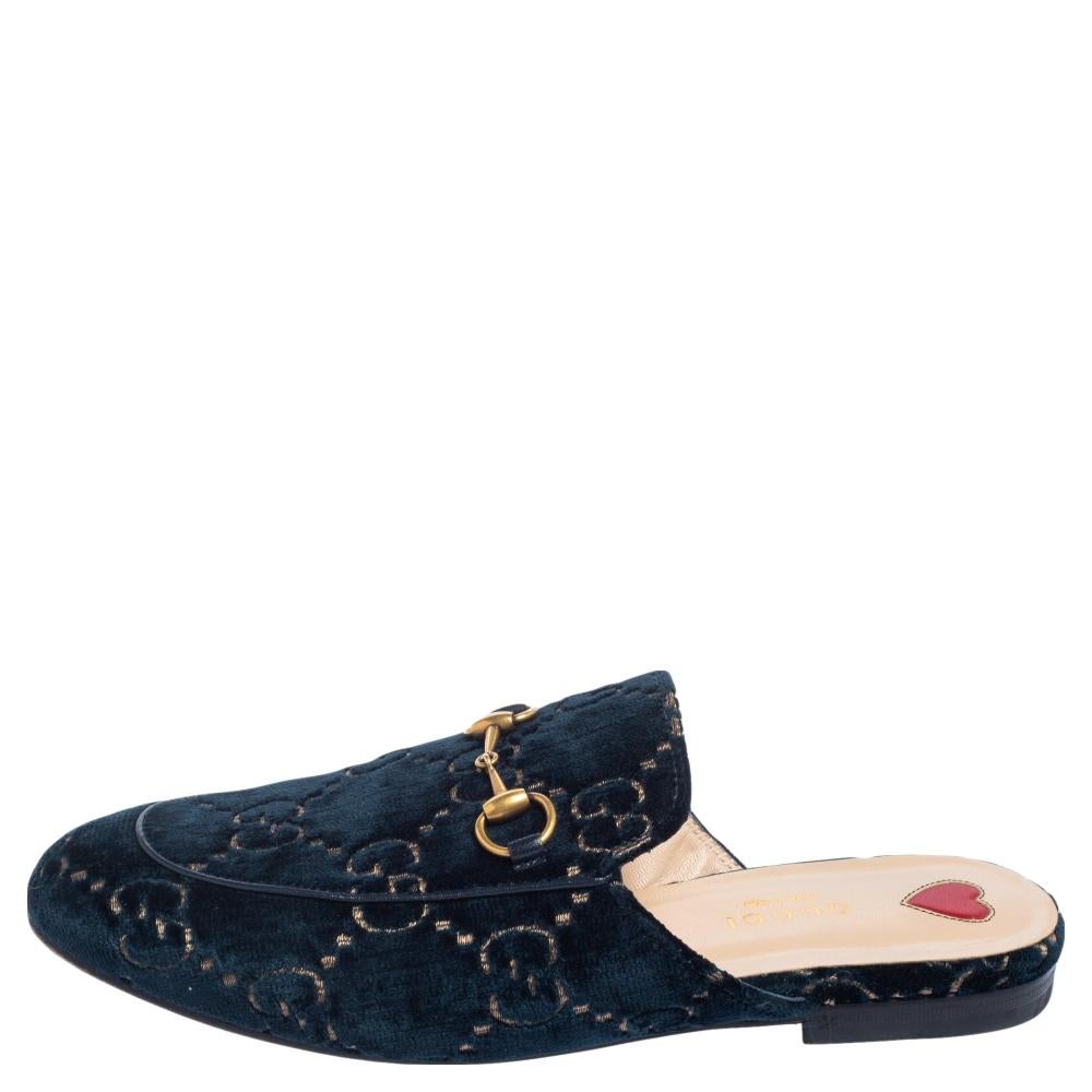 These Gucci Princetown mules are a fresh update on the perennially chic Gucci loafers. They are enhanced by the signature Horsebit hardware details that have defined the Gucci collection since the very beginning. Featuring a GG velvet body, these