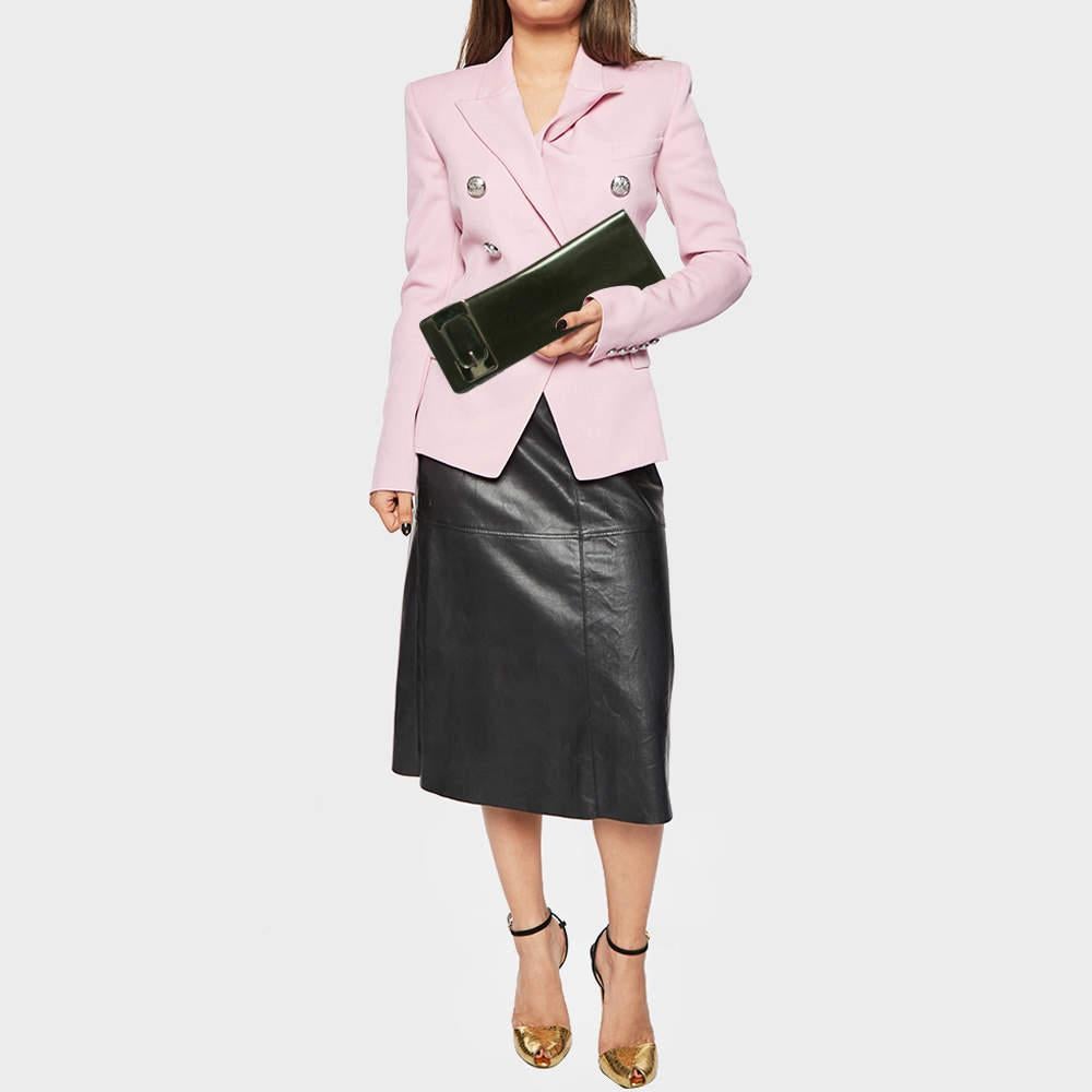 Highlight your outfit with this classic buckle clutch by Gucci. The patent leather exterior has a glitter effect and a large buckle detail.

Includes: Original Dustbag