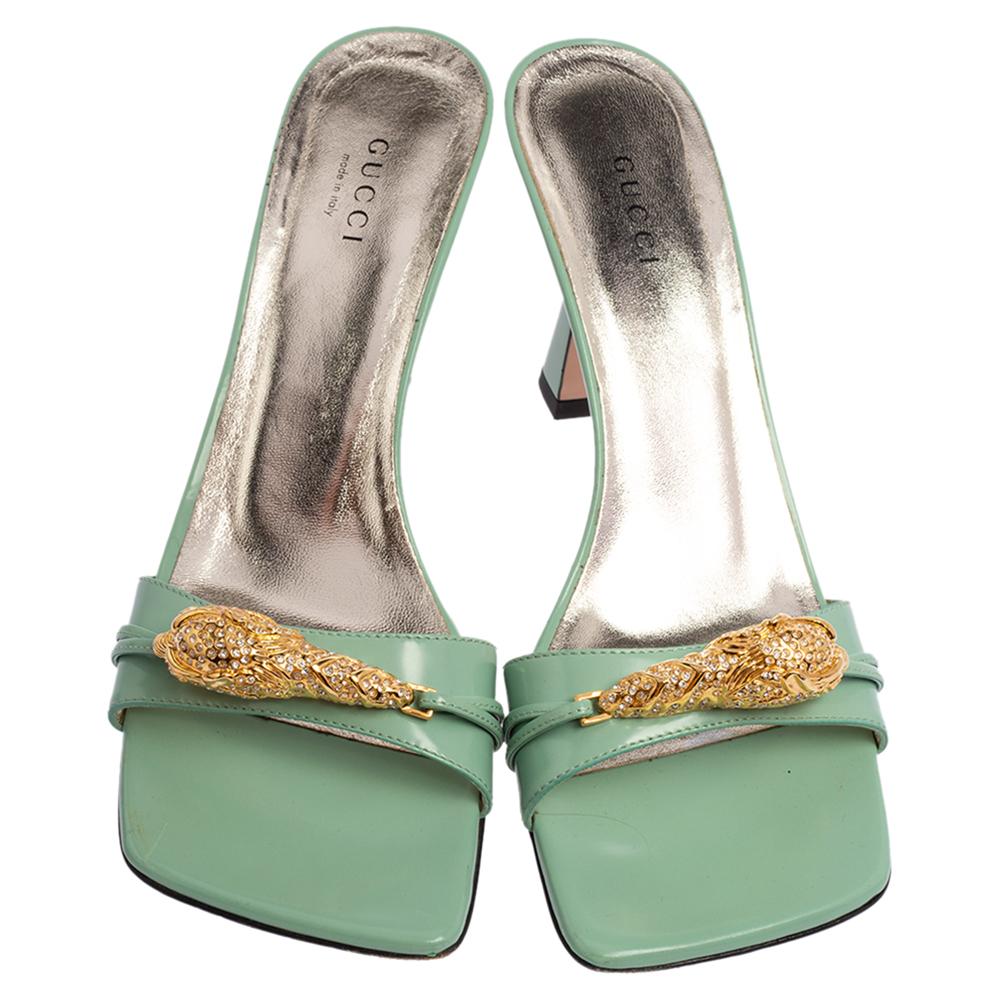 Chic and glamorous, these Dora sandals from Gucci will elevate any outfit. They are great for evenings. They have been crafted from glossy leather and come in a classy shade of green. They are styled with open toes, single vamps straps that carry
