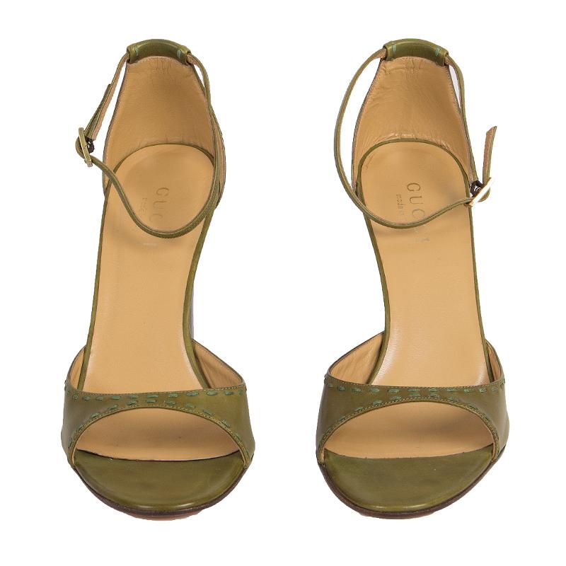 100% authentic Gucci ankle-strap sandals in green leather. Close with a gold-tone buckle on the side. Brand new. 

Measurements
Imprinted Size	40C
Shoe Size	40
Inside Sole	26cm (10.1in)
Width	8cm (3.1in)
Heel	11cm (4.3in)
Hardware	Gold-Tone

All our