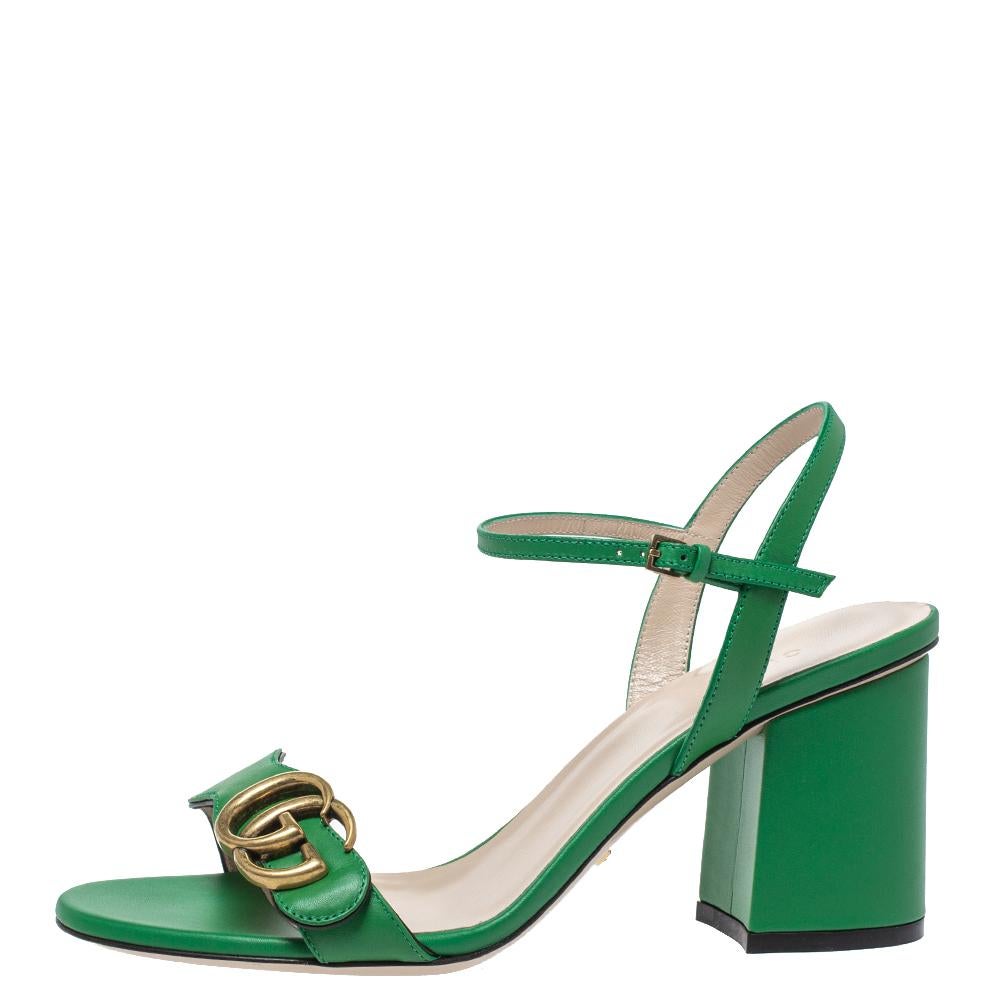 How gorgeous are these GG Marmont sandals from Gucci! Crafted in Italy, they are made from leather and adorned in a green shade. They are styled with open toes, GG logo on the vamp straps, buckled ankle straps, low block heels, and gold-tone