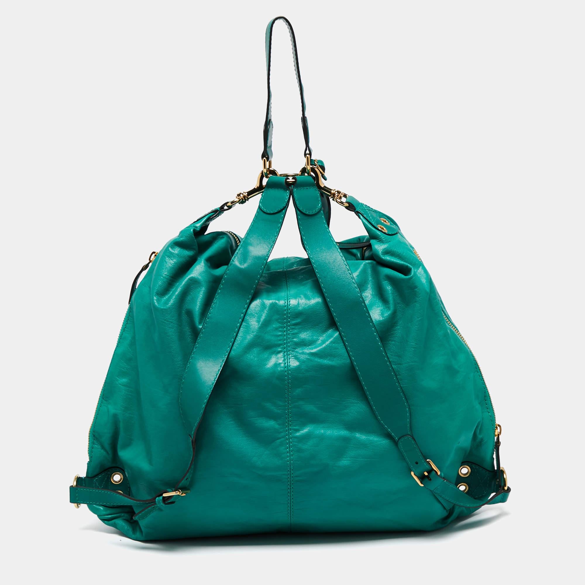 Add some elevation to your everyday attire with this super stylish backpack. The Gucci creation is made from green leather and is held by two shoulder straps and a top handle. It is equipped with a spacious interior and flaunts multiple zip pockets