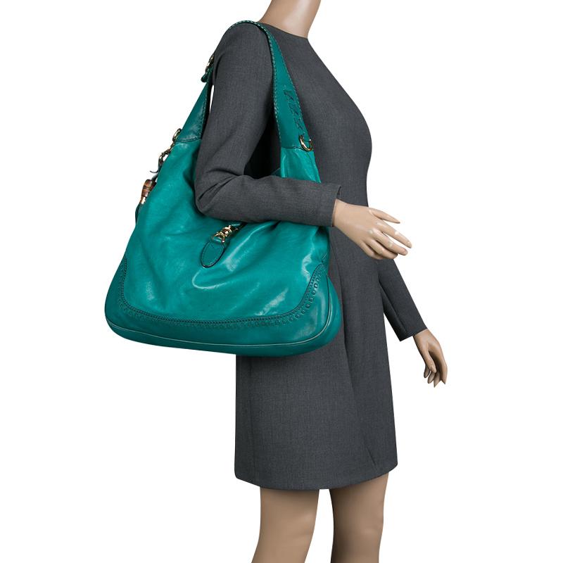 A handbag should not only be good-looking but also durable, just like this pretty green New Jackie bag from Gucci. Crafted from leather in Italy, this gorgeous number has the signature closure that opens up to a spacious nylon interior. Complete