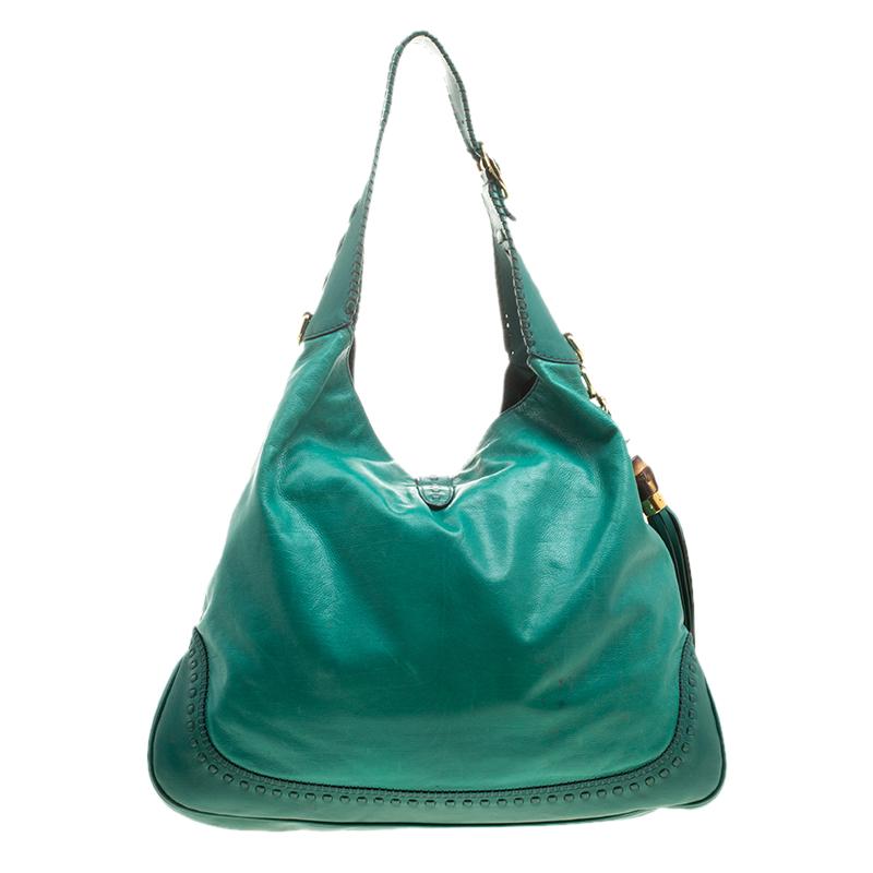 A handbag should not only be good-looking but also durable, just like this pretty green New Jackie bag from Gucci. Crafted from leather in Italy, this gorgeous number has the signature closure that opens up to a spacious nylon interior. Complete