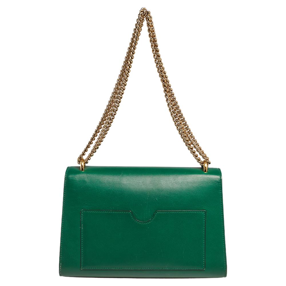 This chic and contemporary Gucci bag will help you outline a stylish look and outshine everyone else! Crafted from leather, the rear side comes with a slip pocket for easy organization. The structured silhouette is secured with a padlock-accented
