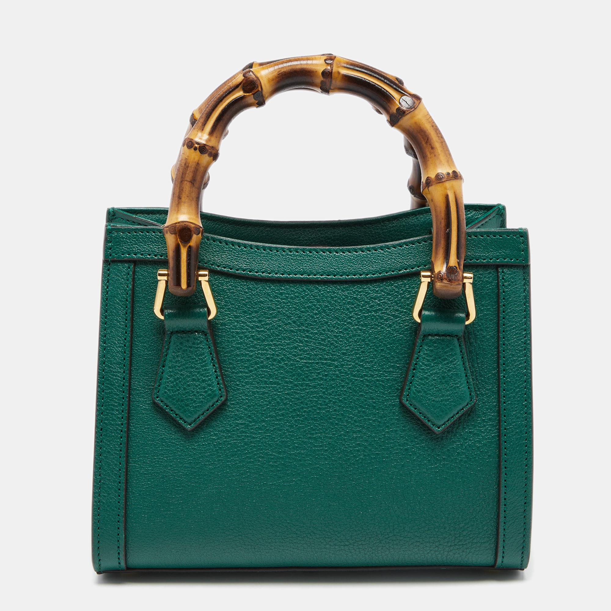 Coming from Gucci is this green tote that is the perfect day bag. It is crafted from leather into a structured shape and flaunts gold-tone details, dual handles, a shoulder strap, and a capacious interior for your belongings. The gorgeous bag will