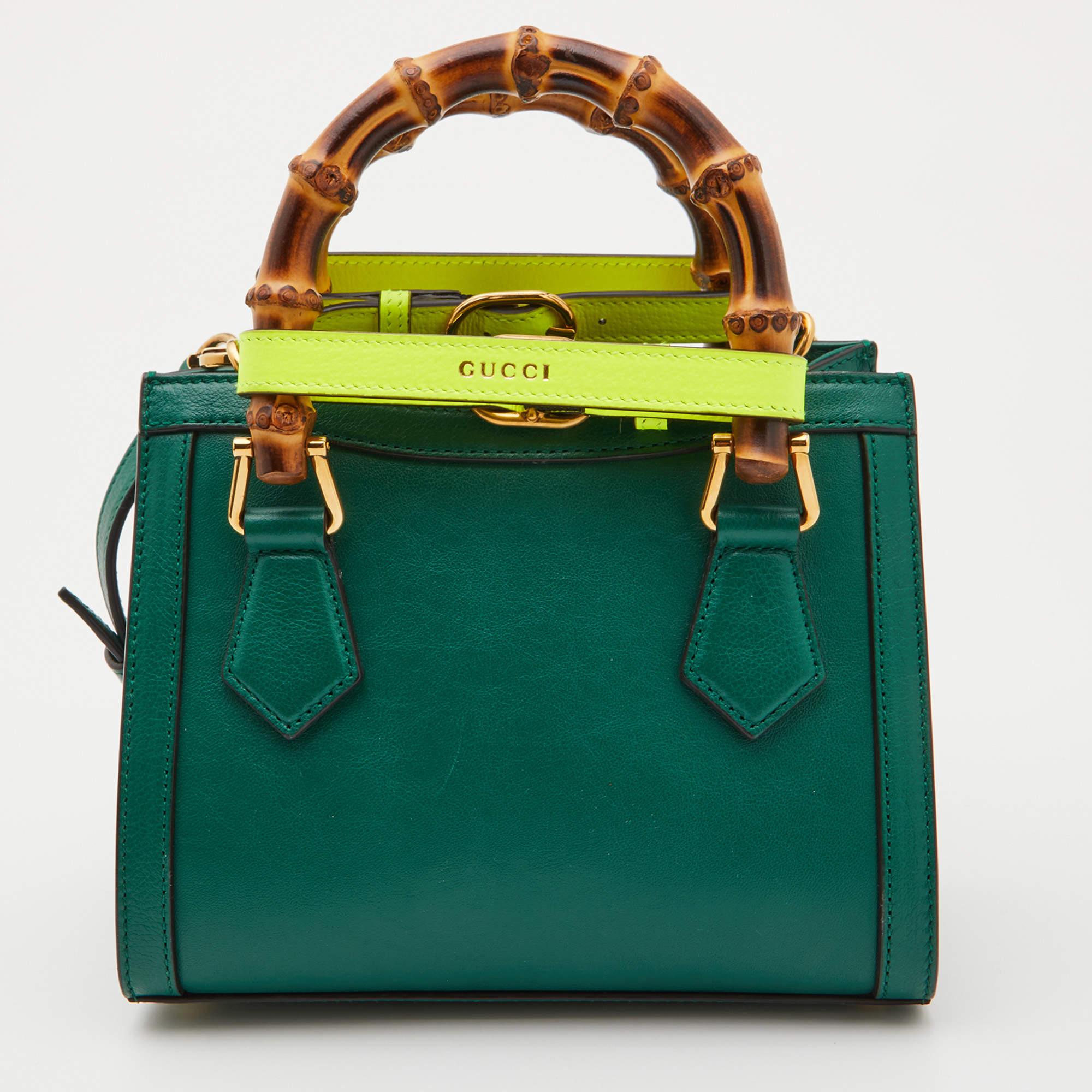 You are going to love owning this Mini Diana tote from Gucci as it is well-made and brimming with luxury. The Diana tote has been crafted from leather and lined with Alcantara on the insides. It has a green hue and two bamboo handles along with a