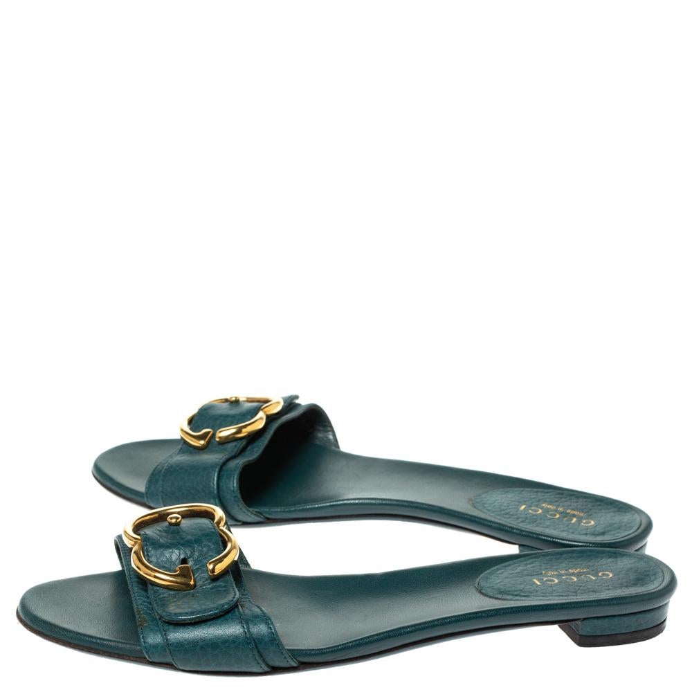 Put your best foot forward this season in these pretty Gucci sandals. These green sandals have been crafted from leather in Italy and they feature gold-tone GG buckle on the vamps as well as insoles meant to provide comfort at every step. These
