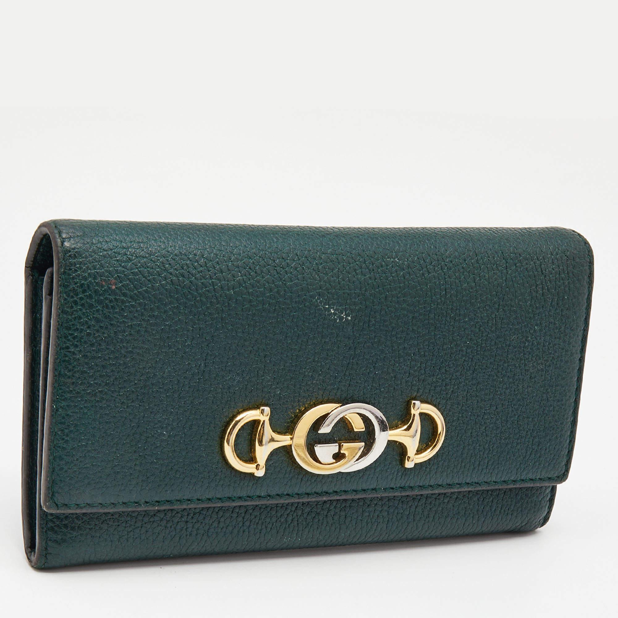 This Zumi wallet from the House of Gucci, with its multi-purposeful style and well-made shape, will prove to be your go-to accessory in no time. It has been made using green leather on the exterior.

