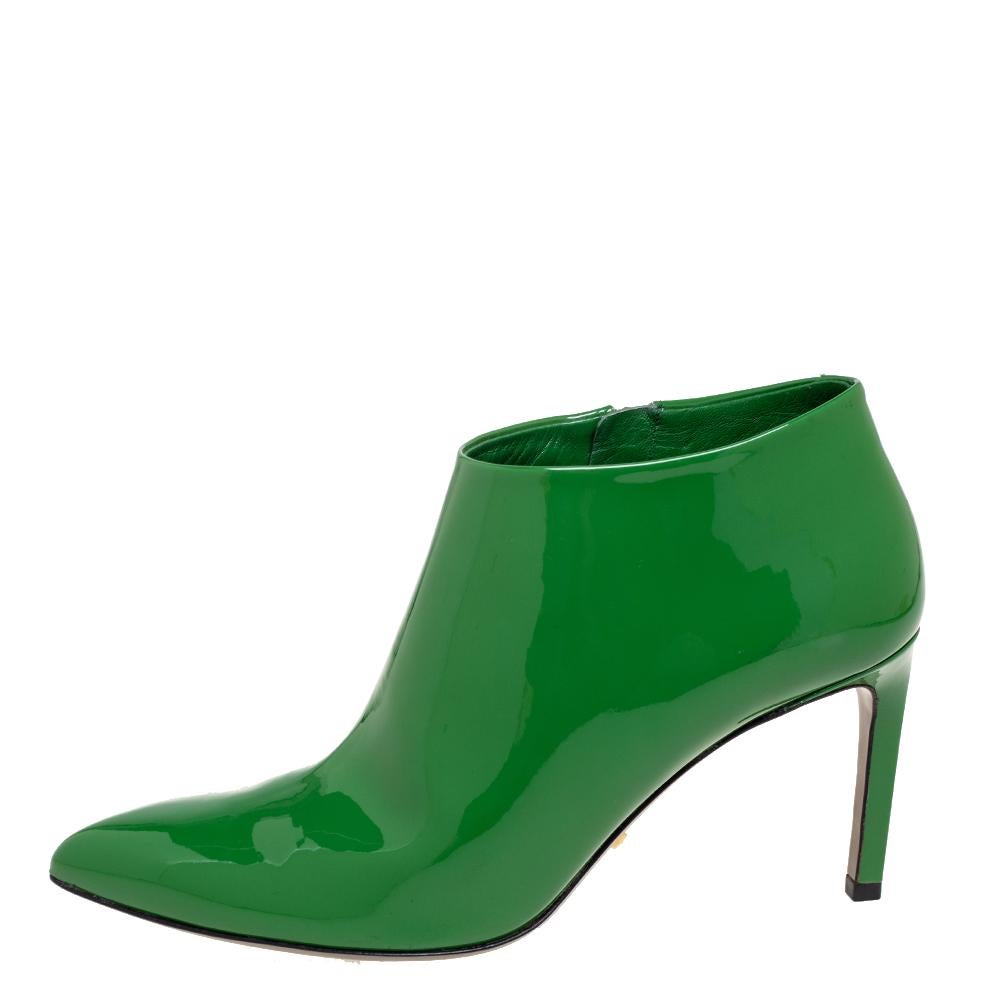Create a stunning silhouette with this pair of ankle boots from Gucci. Crafted from patent leather, the shoes are styled with pointed toes, secured with side zippers, and elevated on 8 cm heels.

Includes: Original dustbag