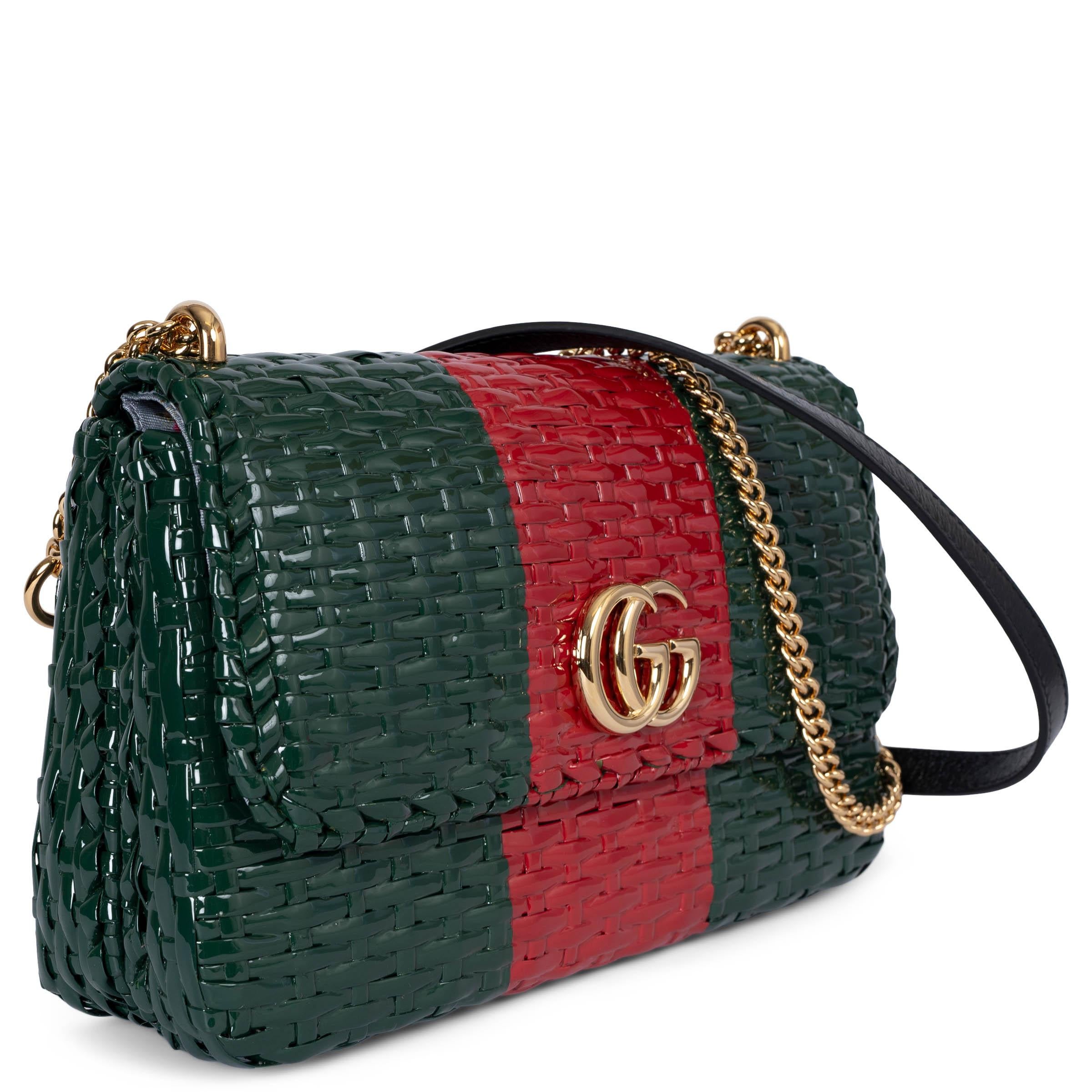 This 100% authentic Gucci Cestino Small flap shoulder bag is crafted from red and green web-striped glossy wicker for a unique, statement-making look. It features a gold-tone GG detail on the front and a stylish chain strap with a black leather