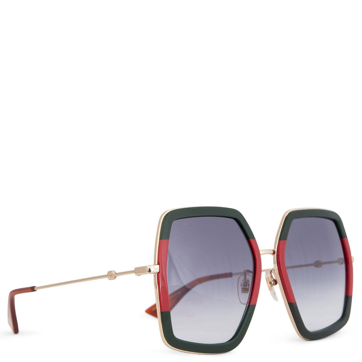 100% authentic Gucci oversized rectangular sunglasses in dark green and red acetate with light gold-tone metal temples. Lenses are in gradient light grey. Have beeb worn and are in excellent condition. Come with case.