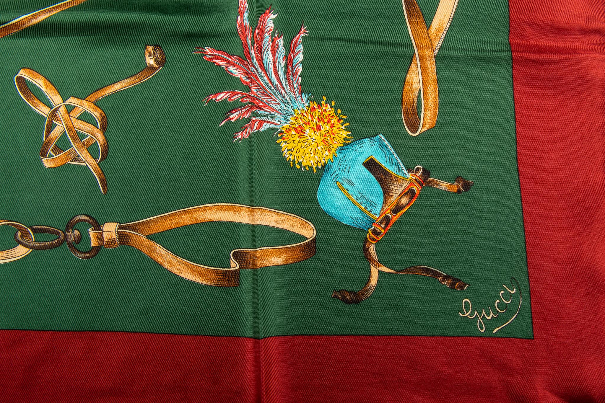 Gucci 100% silk scarf in green with red trim. Birds design. Hand rolled edges.
