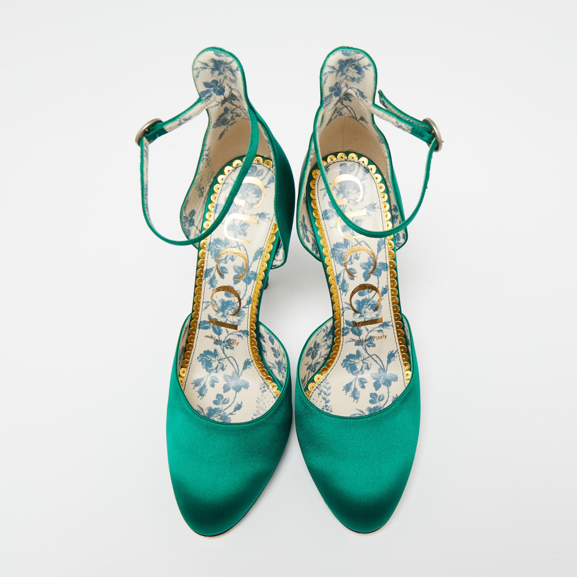 Make a grand entrance at the next party by donning these gorgeous green pumps from the house of Gucci. They are crafted from exquisite satin and have a closed-toe, buckled ankle-strap silhouette. They are beautifully supported by extended counters