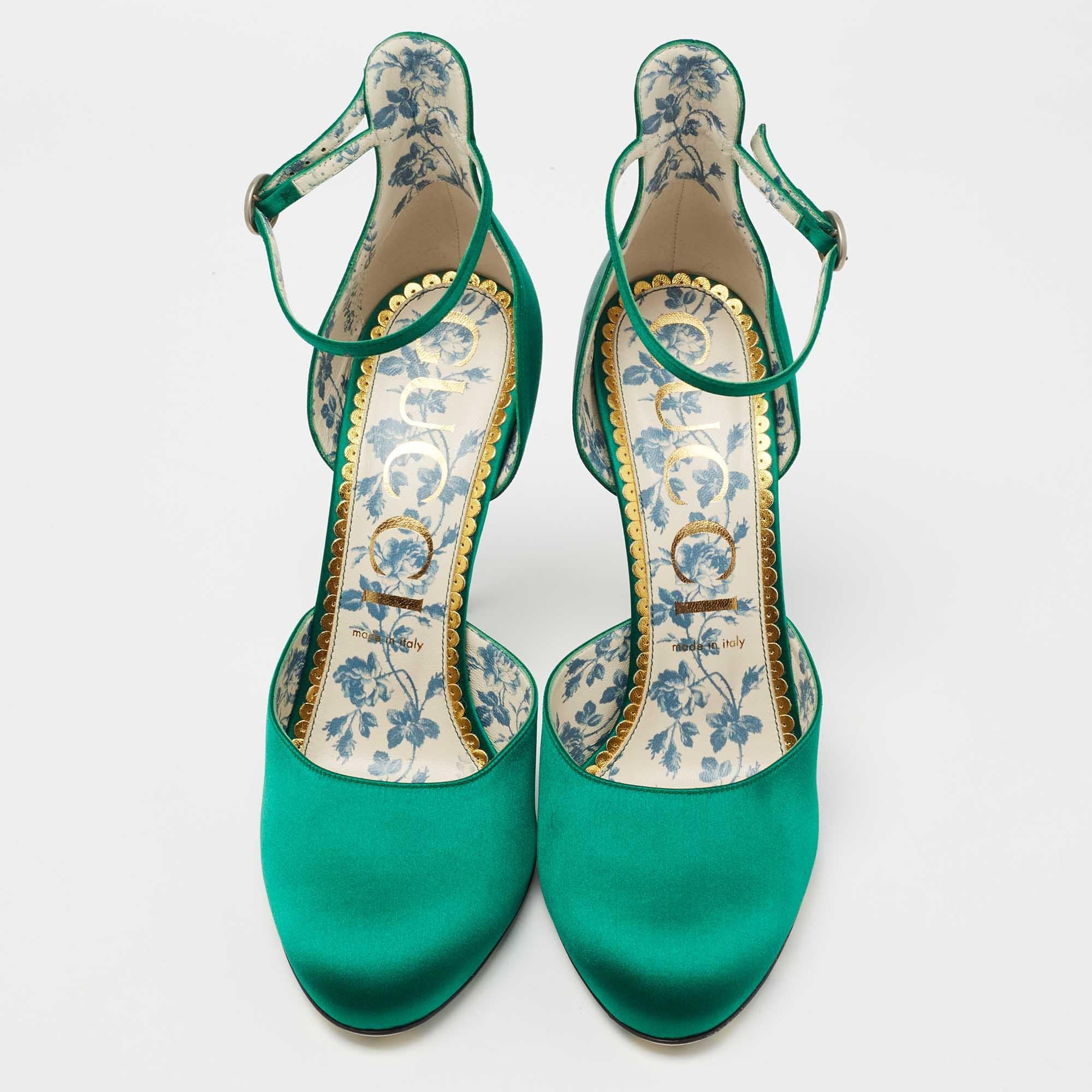 Make a grand entrance at the next party by donning these gorgeous green pumps from the house of Gucci. They are crafted from exquisite satin and have a closed-toe, buckled ankle-strap silhouette. They are beautifully supported by extended counters